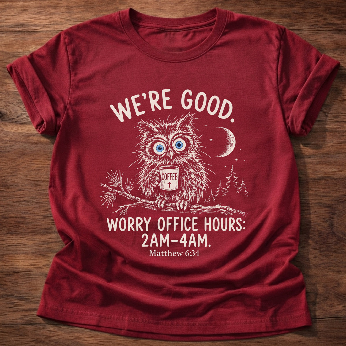 Cherry Red t-shirt printed with a wide-eyed owl holding a mug on a moonlit branch graphic and “We're good. Worry office hours: 2AM-4AM.” Matthew 6:34 Christian shirt