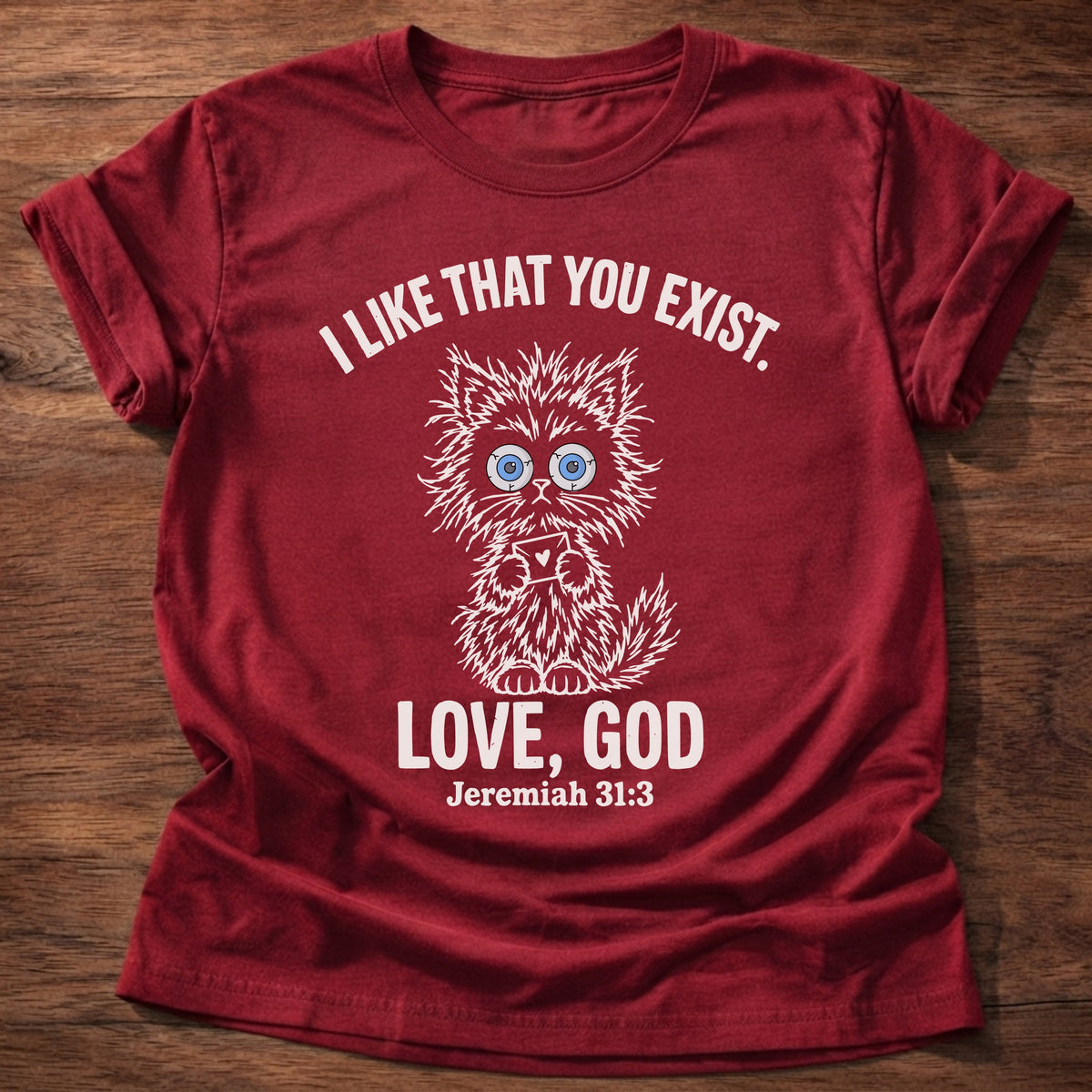 Cherry Red t-shirt printed with a fluffy wide-eyed kitten graphic and “I like that you exist. Love, God.” Jeremiah 31:3 Christian shirt