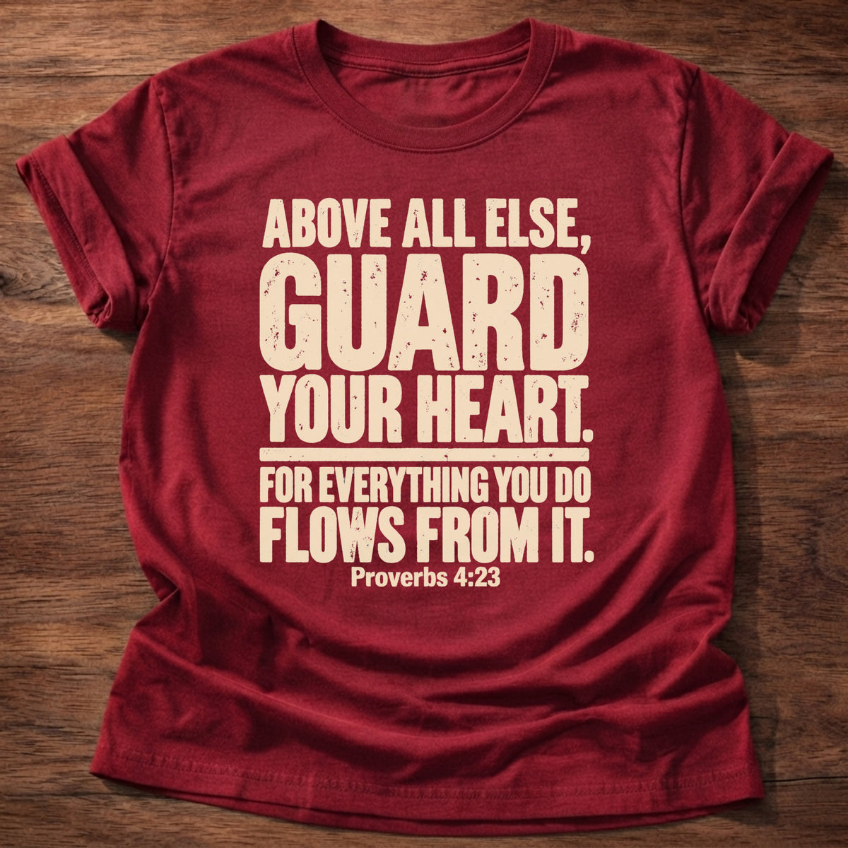 Cherry Red t-shirt printed with bold stacked typography graphic and “Above all else, guard your heart, for everything you do flows from it.” Proverbs 4:23 Christian shirt