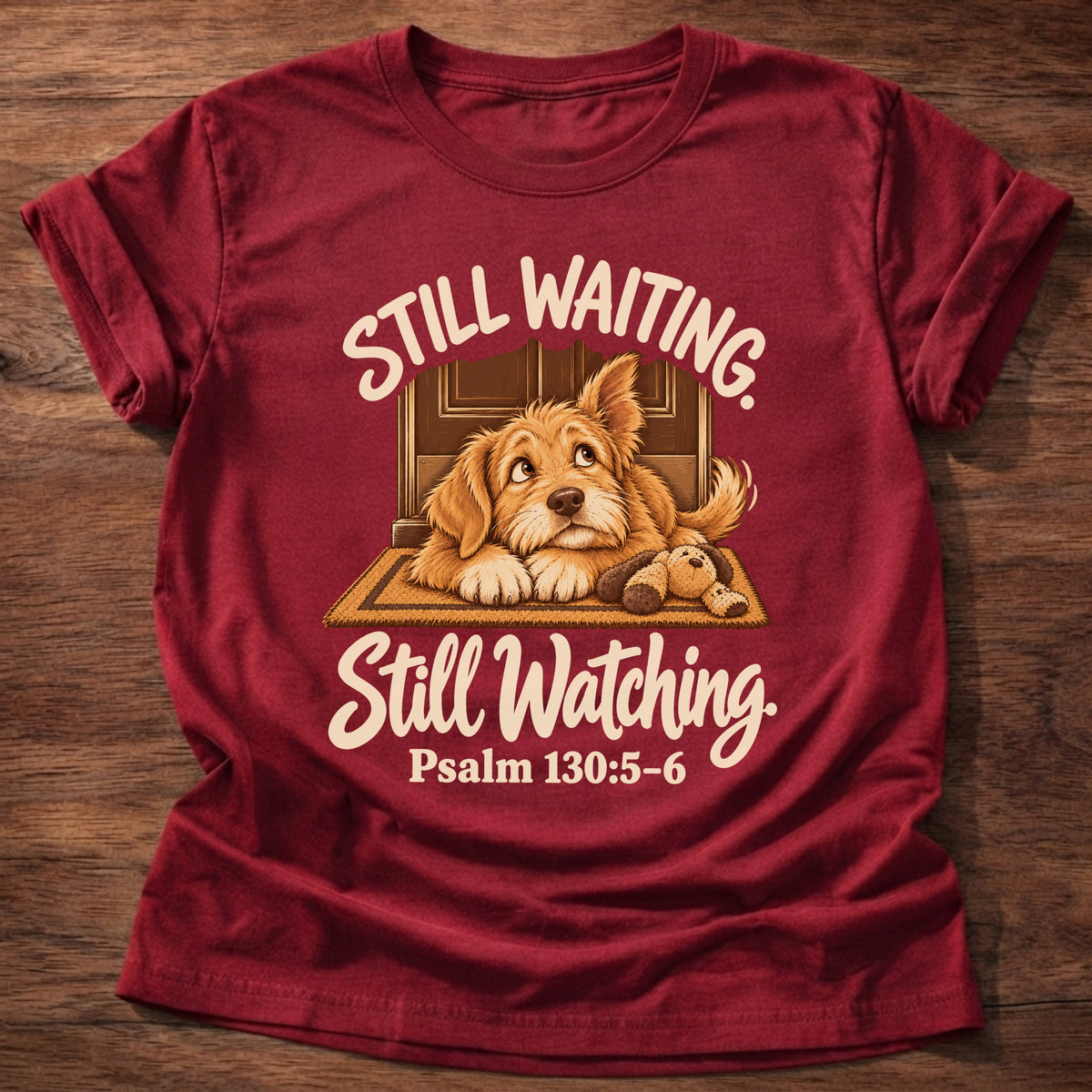 Cherry Red t-shirt printed with a puppy lying on a doormat waiting at the door and “Still waiting. Still watching.” Psalm 130:5-6 Christian shirt