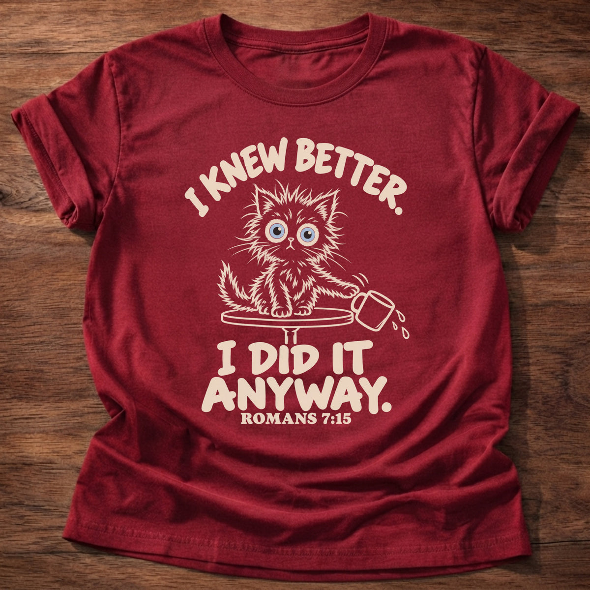 Cherry Red t-shirt printed with a scruffy kitten knocking a cup off a table and “I knew better. I did it anyway.” Romans 7:15 Christian shirt