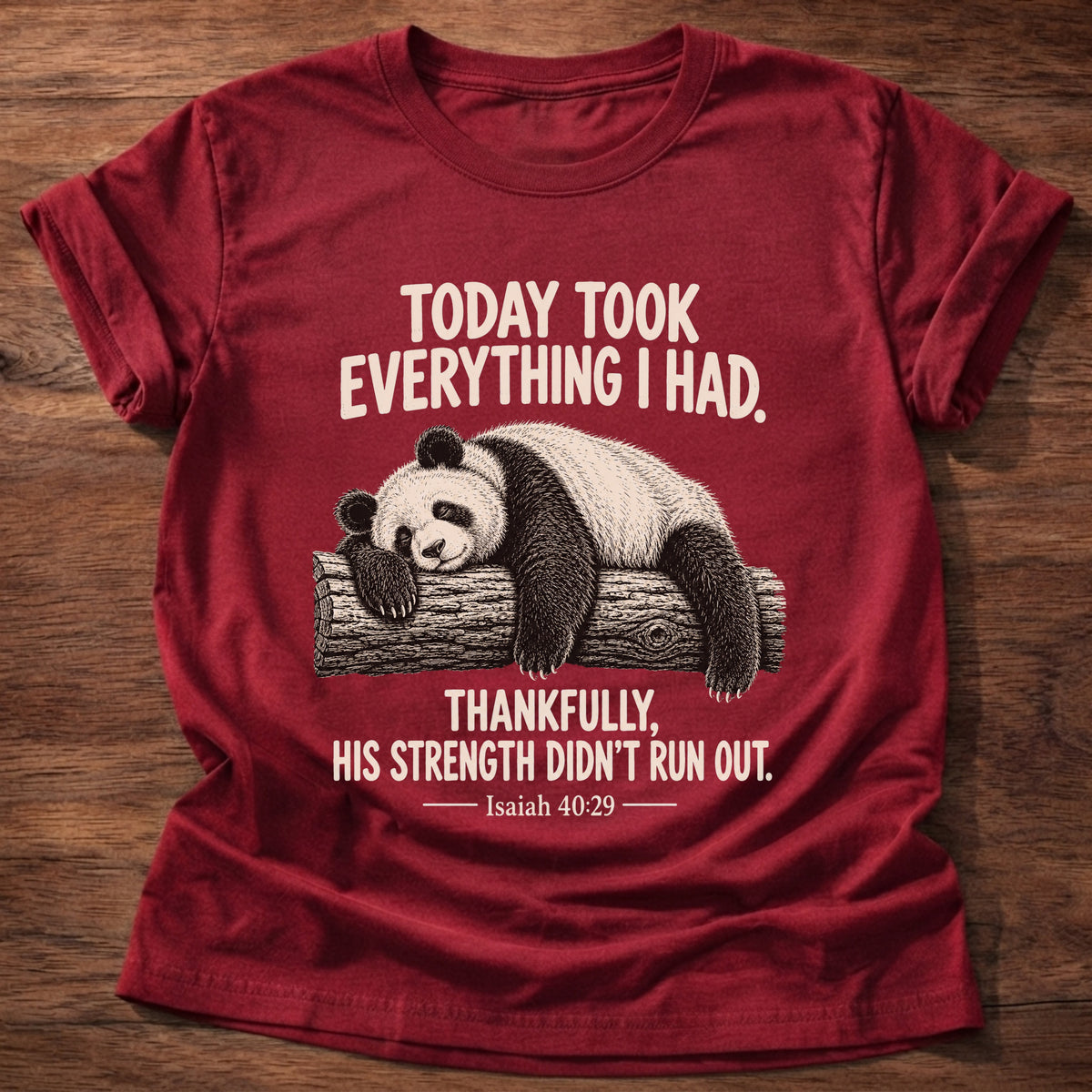 Cherry Red t-shirt printed with a panda sleeping draped over a log graphic and “Today took everything I had. Thankfully, His strength didn't run out.” Isaiah 40:29 faith based gift