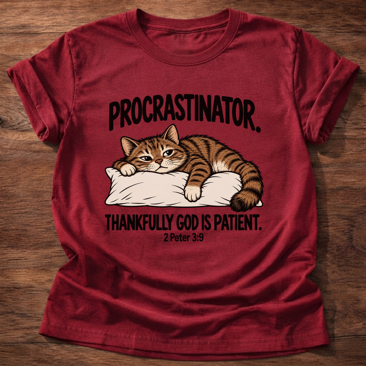 Cherry Red t-shirt printed with a cat sleeping on a pillow graphic and 'Procrastinator. Thankfully God is patient.' 2 Peter 3:9 faith based gift