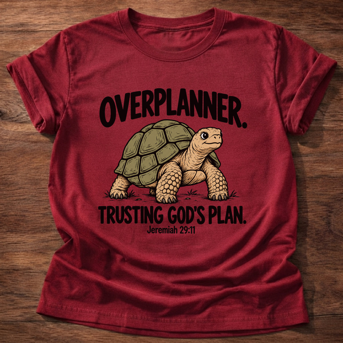 Cherry Red t-shirt printed with a turtle graphic and 'Overplanner. Trusting God's plan.' Jeremiah 29:11 faith based gift