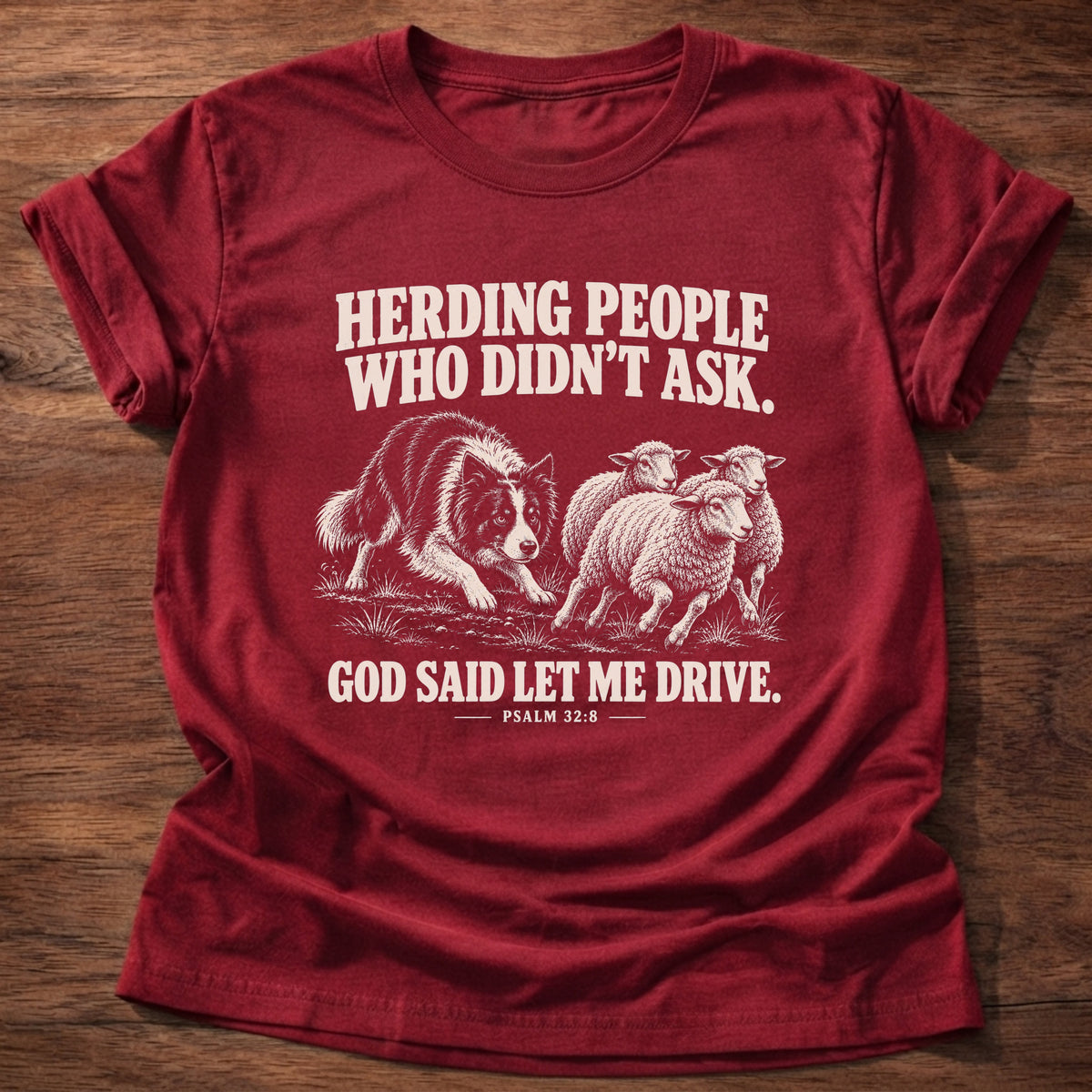 Cherry Red t-shirt printed with a border collie herding a flock of sheep graphic and 'Herding people who didn't ask. God said let me drive.' Psalm 32:8 faith based gift