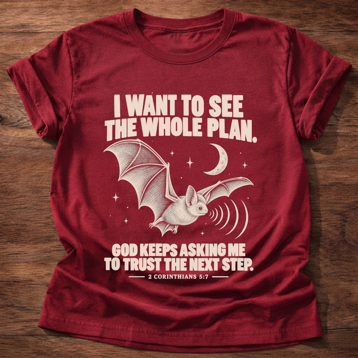Cherry Red t-shirt printed with a bat flying under a night sky graphic and 'I want to see the whole plan. God keeps asking me to trust the next step.' 2 Corinthians 5:7 faith based gift