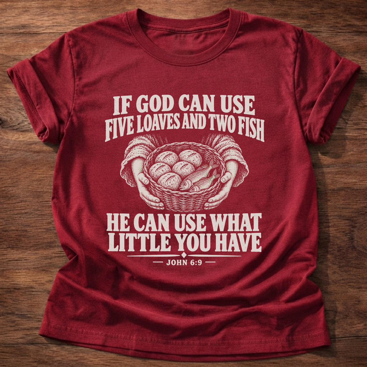 Cherry Red t-shirt printed with a basket of loaves and fish graphic and 'If God can use five loaves and two fish, He can use what little you have.' John 6:9 faith based gift