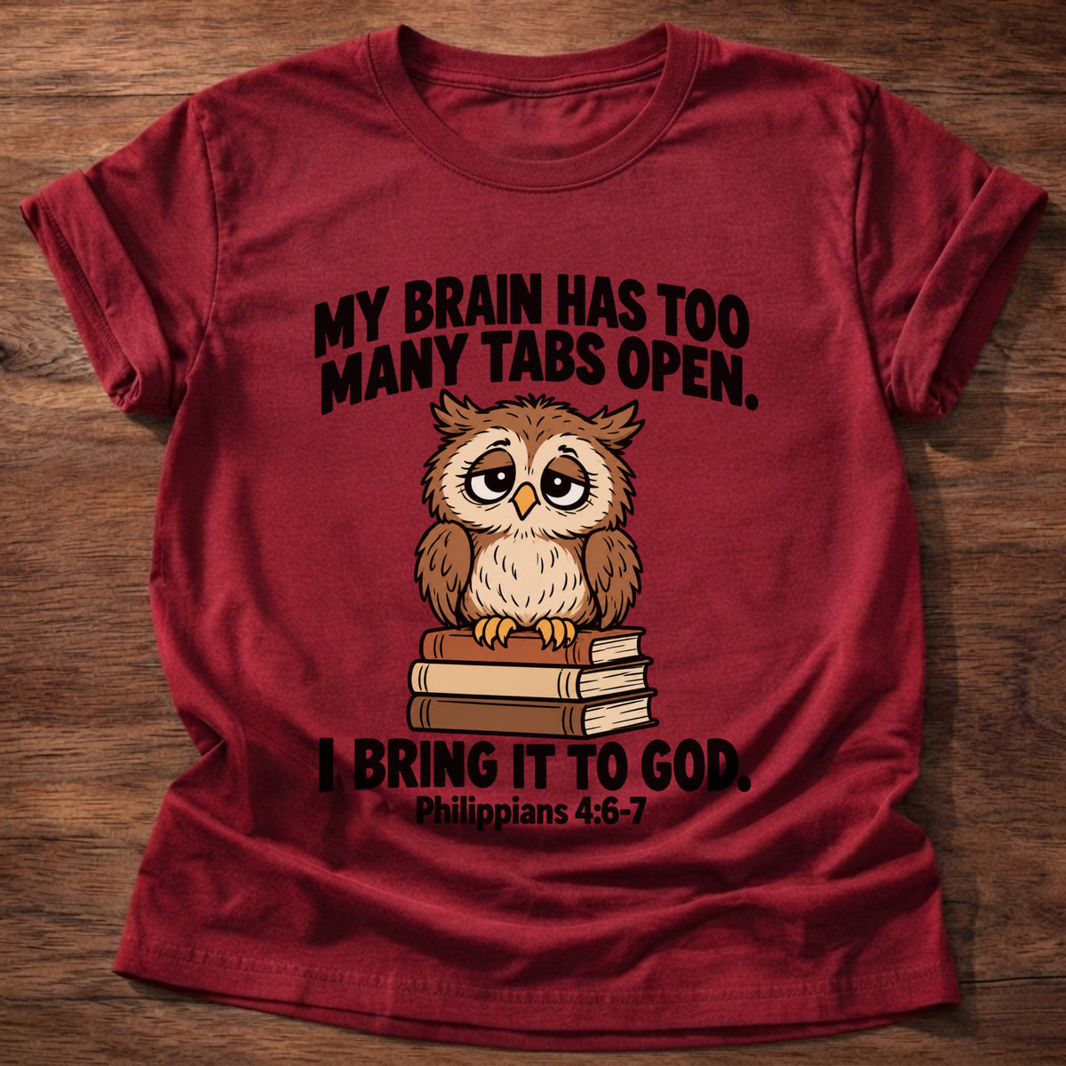 Cherry Red t-shirt printed with an owl surrounded by books graphic and 'My brain has too many tabs open. I bring it to God.' Philippians 4:6-7 faith based gift