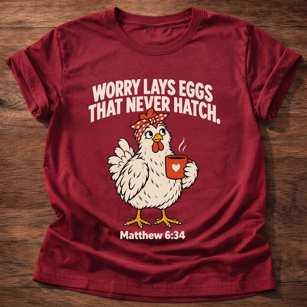 Cherry Red t-shirt printed with a chicken holding a tea cup graphic and 'Worry lays eggs that never hatch. I bring it to God.' Matthew 6:34 faith based gift