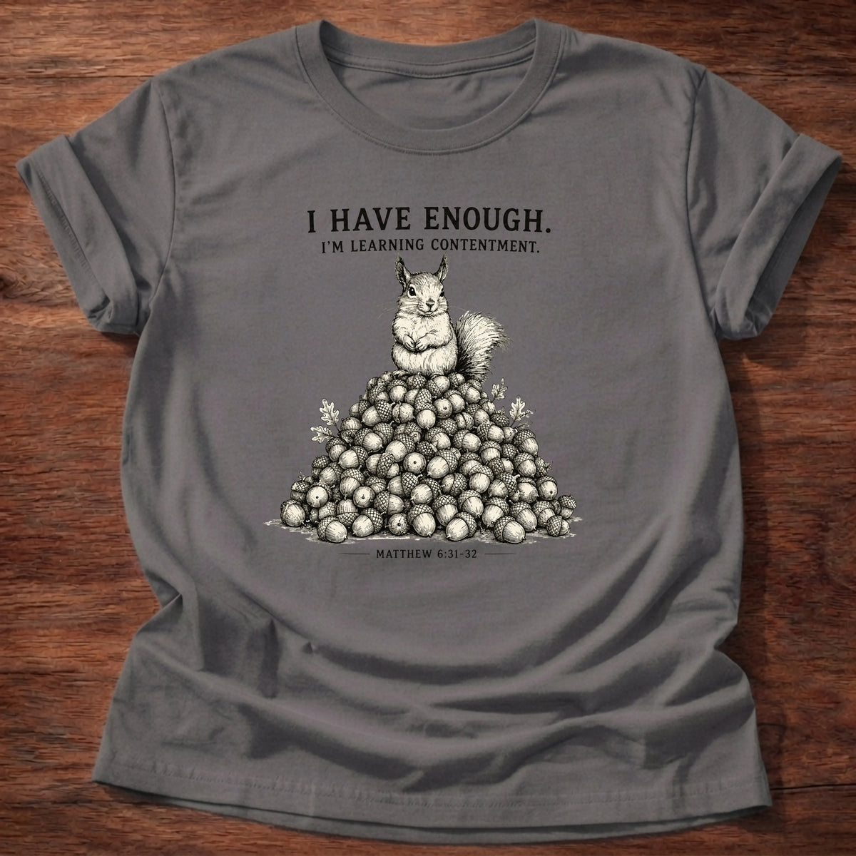 Charcoal Gildan 64000 t-shirt with a squirrel and acorns illustration and 'I Have Enough, I'm Learning Contentment' text, Philippians 4:11 Christian t-shirt
