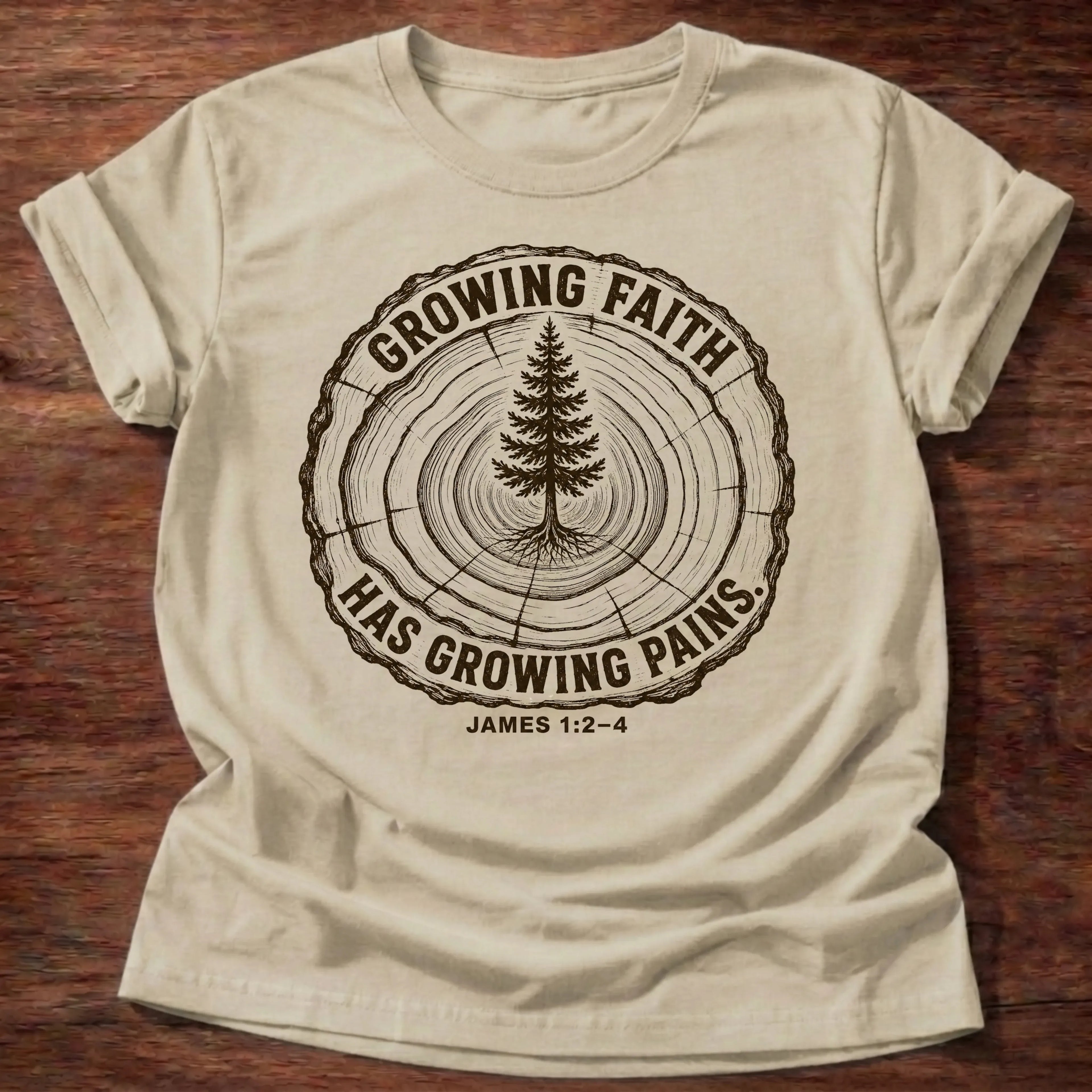 Sand Gildan 64000 t-shirt with a tree rings and pine tree illustration and 'Growing Faith Has Growing Pains' text, James 1:2-4 Christian t-shirt