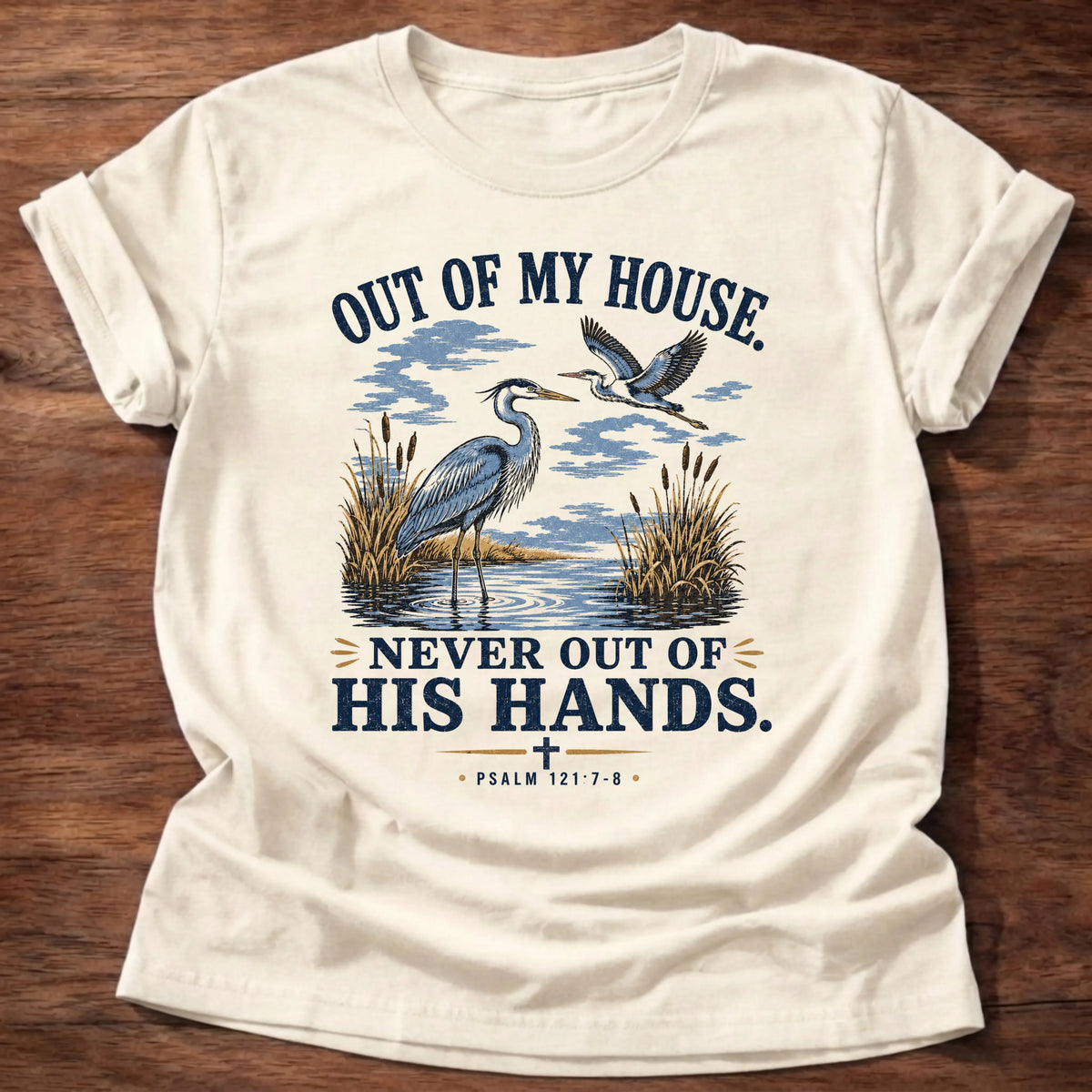 Natural Gildan 64000 t-shirt with a heron illustration and 'Out Of My House, Never Out Of His Hands' text, Christian t-shirt