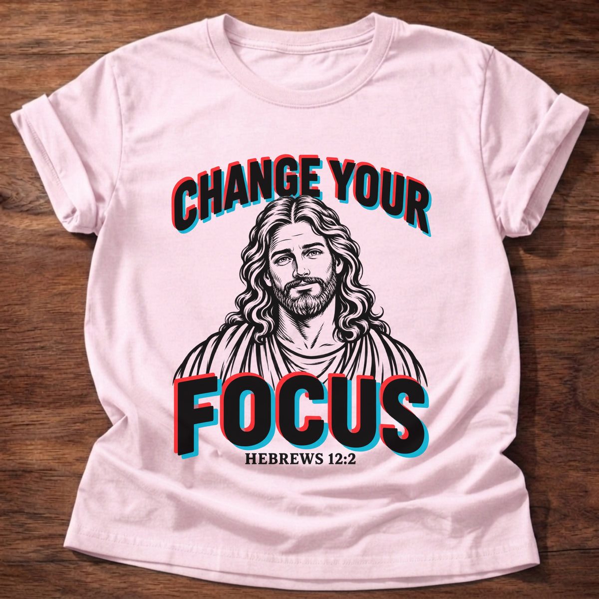 Light Pink t-shirt printed with a vintage-style portrait of Jesus graphic and “Change your focus.” Hebrews 12:2 Christian shirt