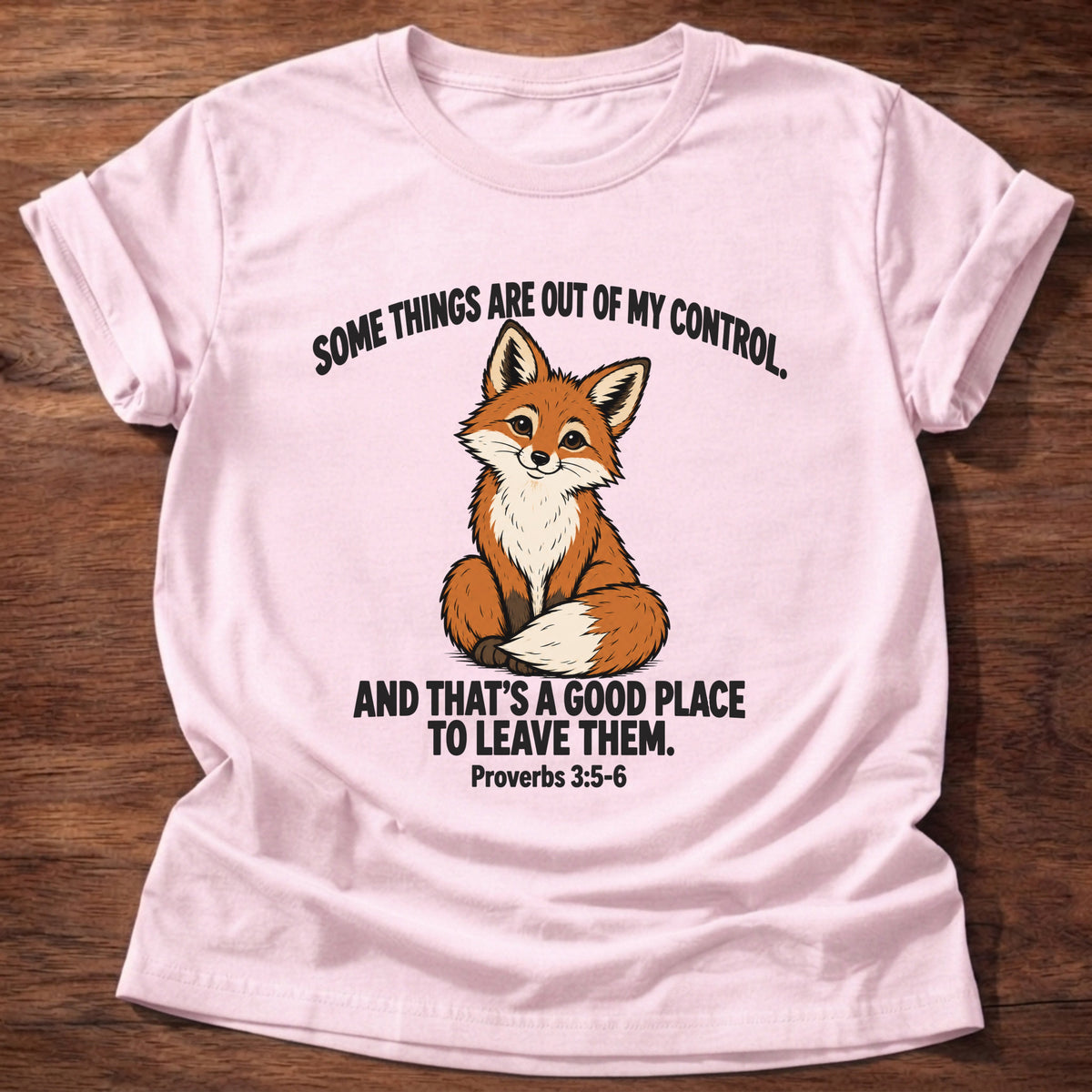 Light Pink t-shirt printed with a fox graphic and 'Some things are out of my control. And that's a good place to leave them.' Proverbs 3:5-6 faith based gift