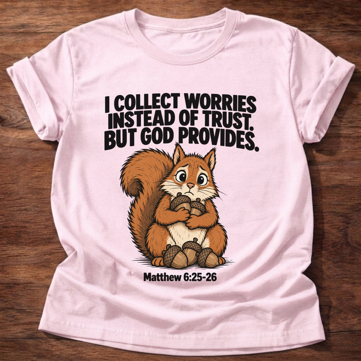 Light Pink t-shirt printed with a raccoon digging through a bin graphic and 'I dig through things I should just leave to God.' Psalm 121:1-2 faith based gift