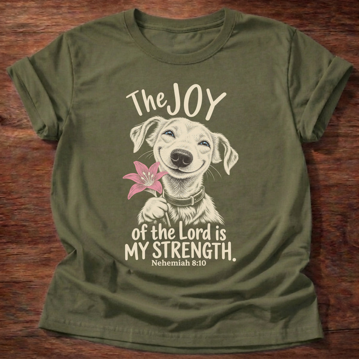 Military Green t-shirt printed with a happy smiling pup holding a flower graphic and “The joy of the Lord is my strength.” Nehemiah 8:10 Christian shirt