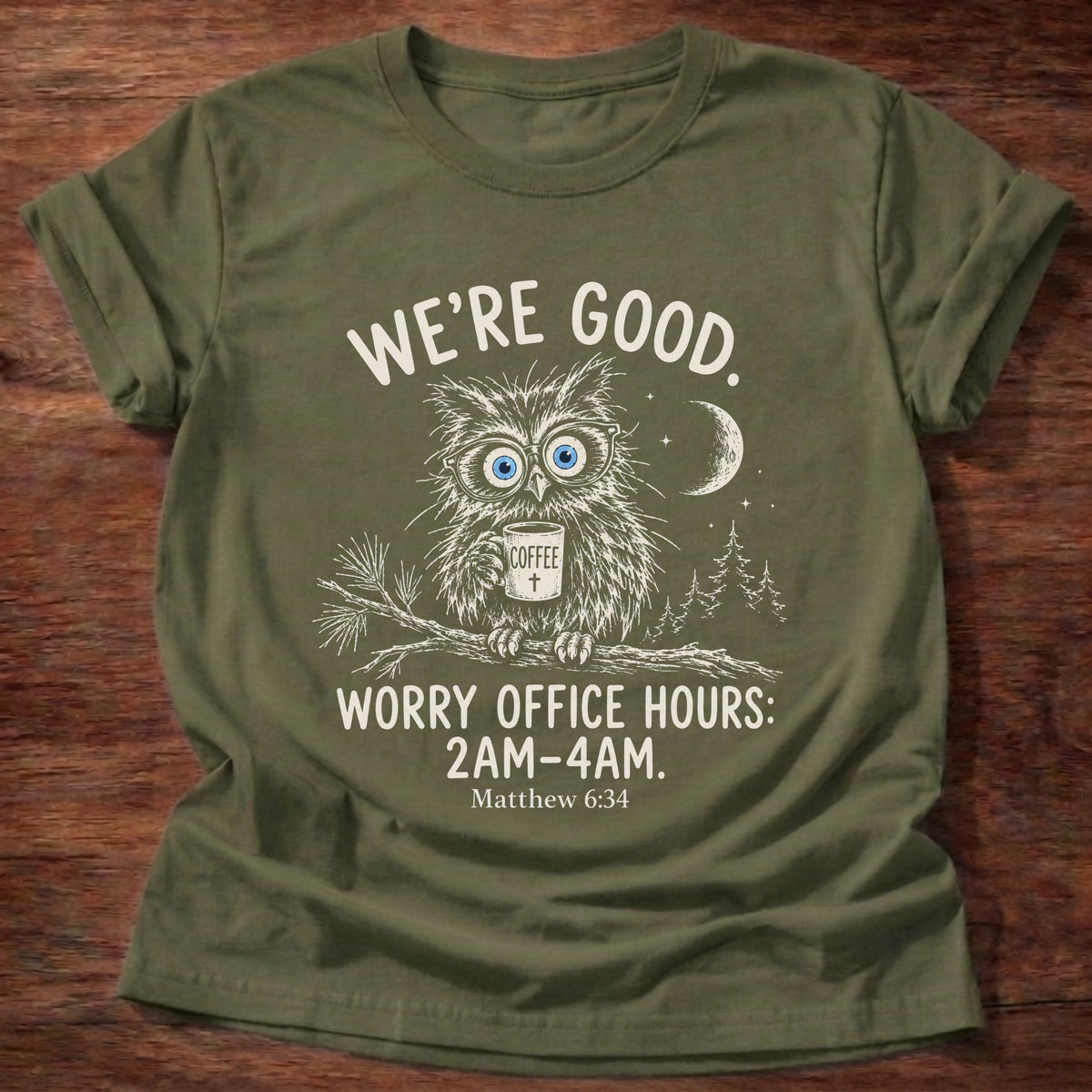 Military Green t-shirt printed with a wide-eyed owl holding a mug on a moonlit branch graphic and “We're good. Worry office hours: 2AM-4AM.” Matthew 6:34 Christian shirt