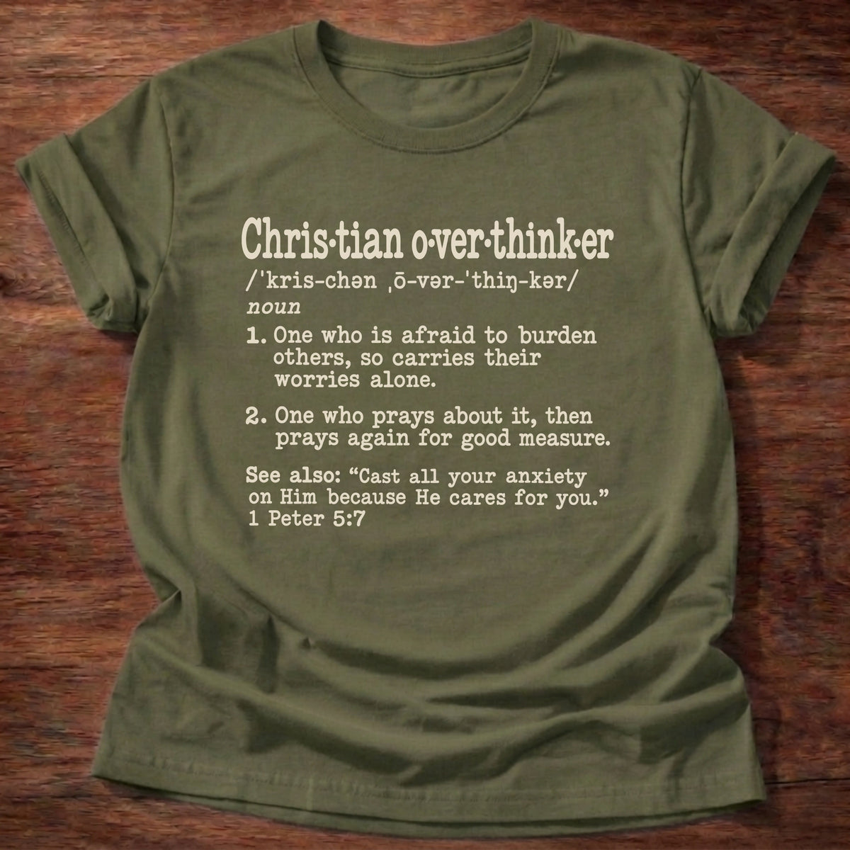 Christian Overthinker T-Shirt in Military Green featuring Christian Overthinker dictionary definition typewriter design with 1 Peter 5:7 cast all your anxiety on Him