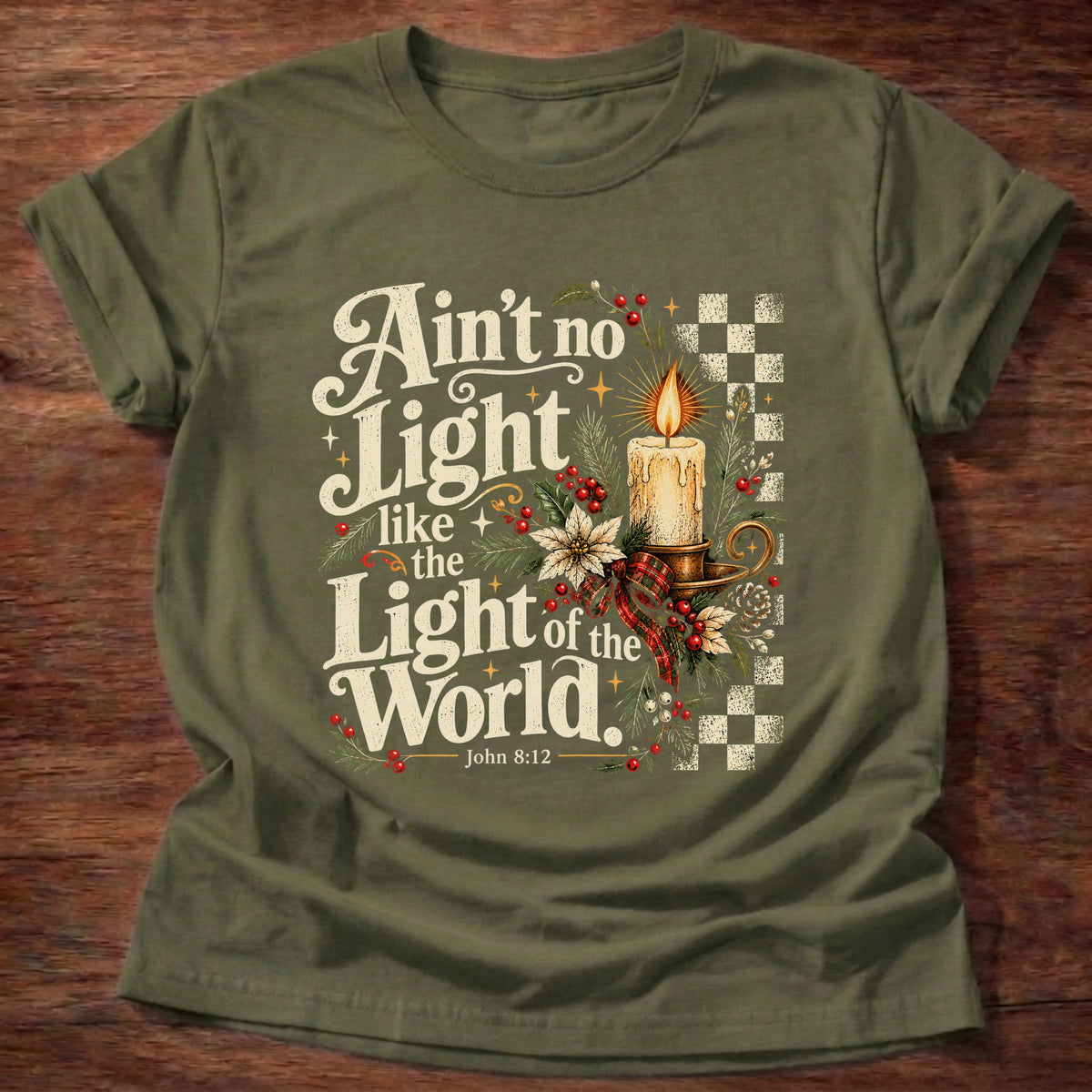 Military Green t-shirt printed with a retro glowing candle with poinsettias and checkerboard graphic and “Ain't no light like the Light of the World.” John 8:12 Christian shirt