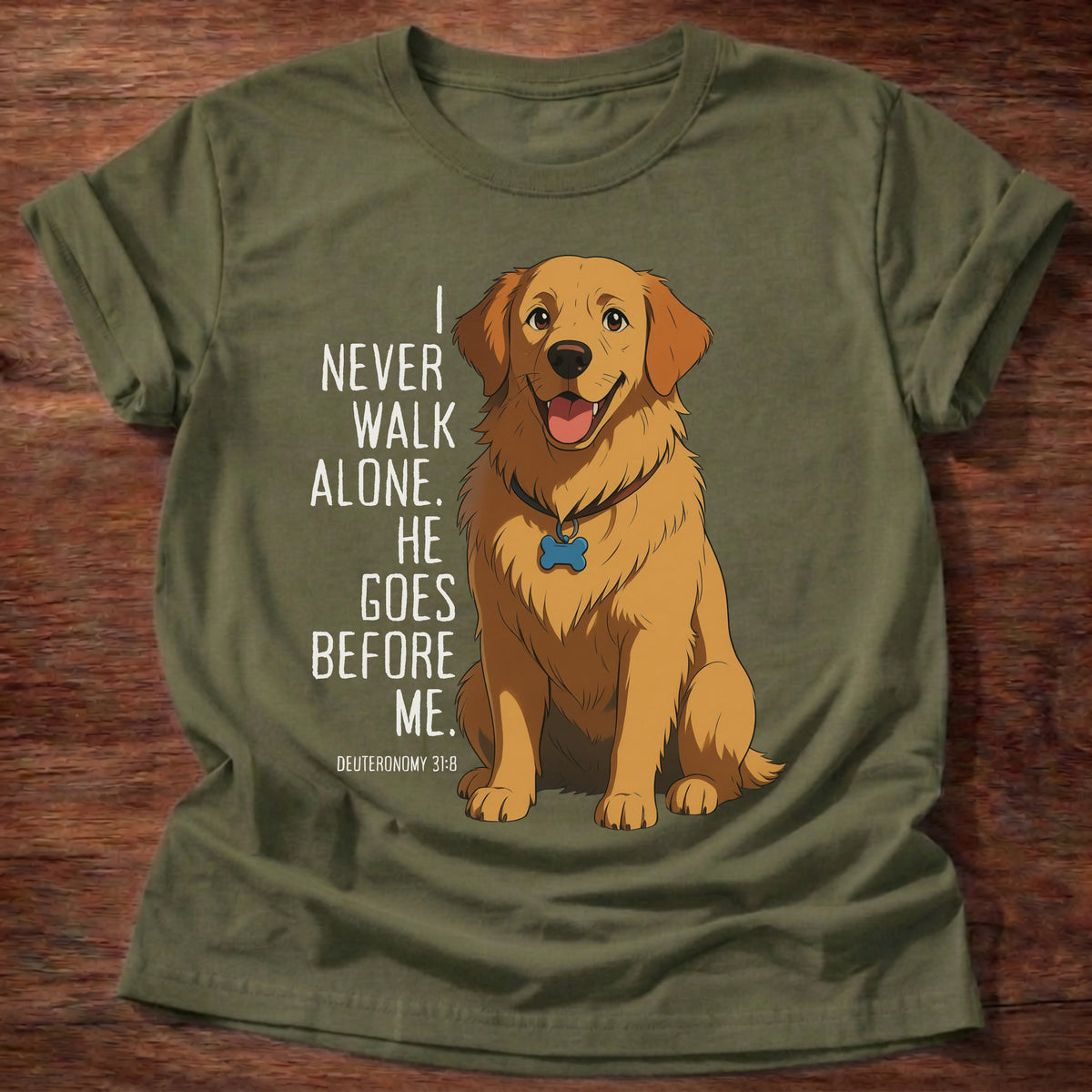 Military Green t-shirt printed with a loyal golden retriever graphic and “I never walk alone. He goes before me.” Deuteronomy 31:8 Christian shirt