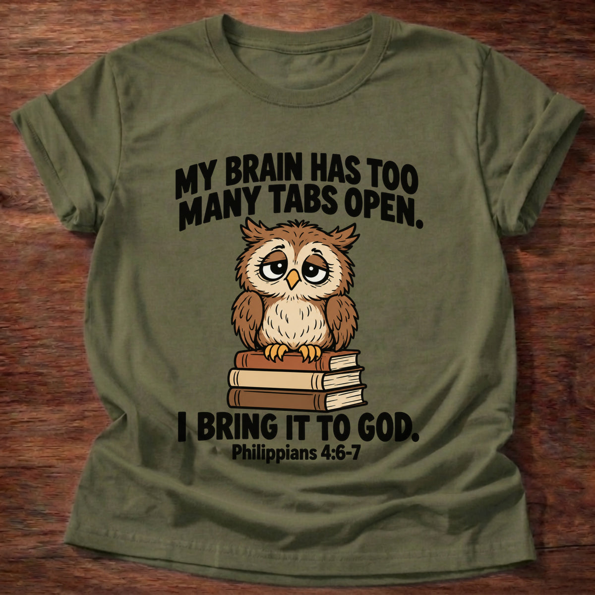 Military Green t-shirt printed with an owl surrounded by books graphic and 'My brain has too many tabs open. I bring it to God.' Philippians 4:6-7 faith based gift
