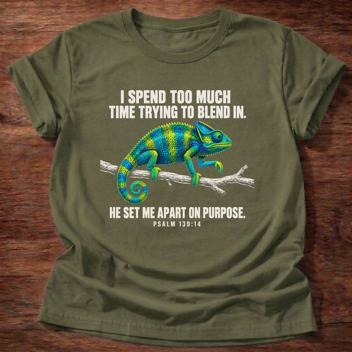 Military Green t-shirt printed with a chameleon blending into a branch graphic and 'I spend too much time trying to blend in. He set me apart on purpose.' Psalm 139:14 faith based gift
