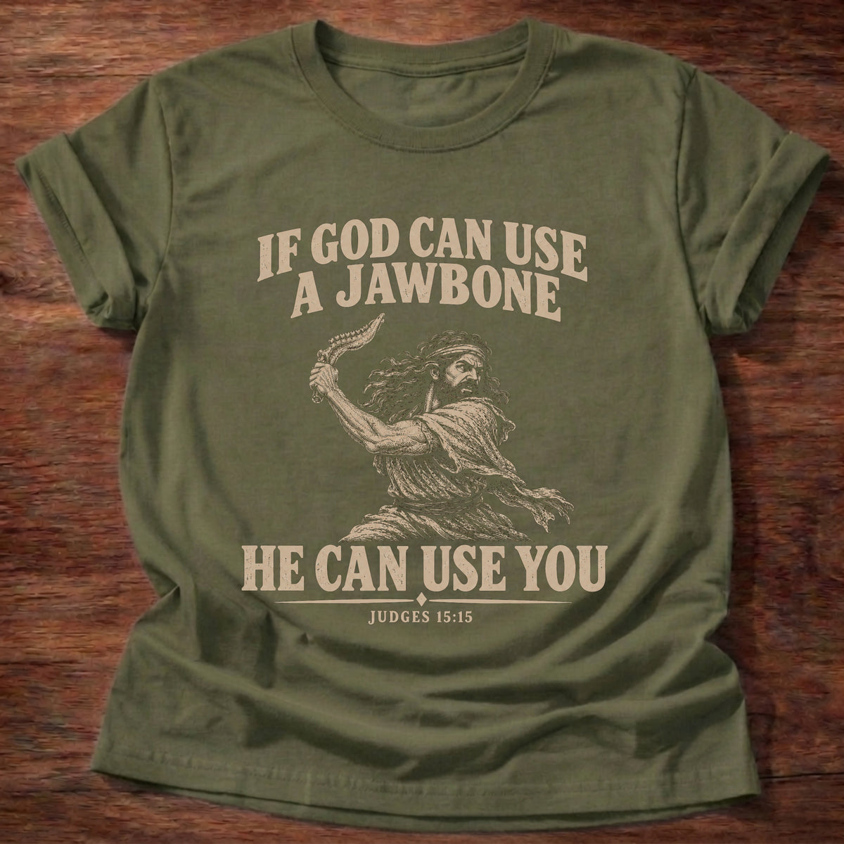 Military Green t-shirt printed with Samson holding a jawbone graphic and 'If God can use a jawbone, He can use you.' Judges 15:15 faith based gift