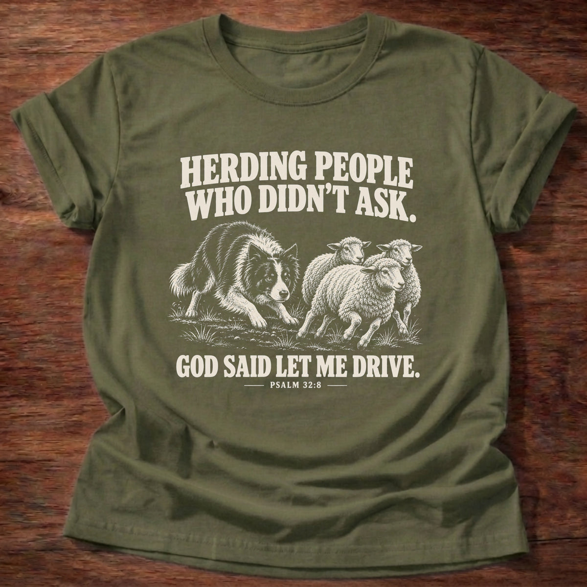 Military Green t-shirt printed with a border collie herding a flock of sheep graphic and 'Herding people who didn't ask. God said let me drive.' Psalm 32:8 faith based gift