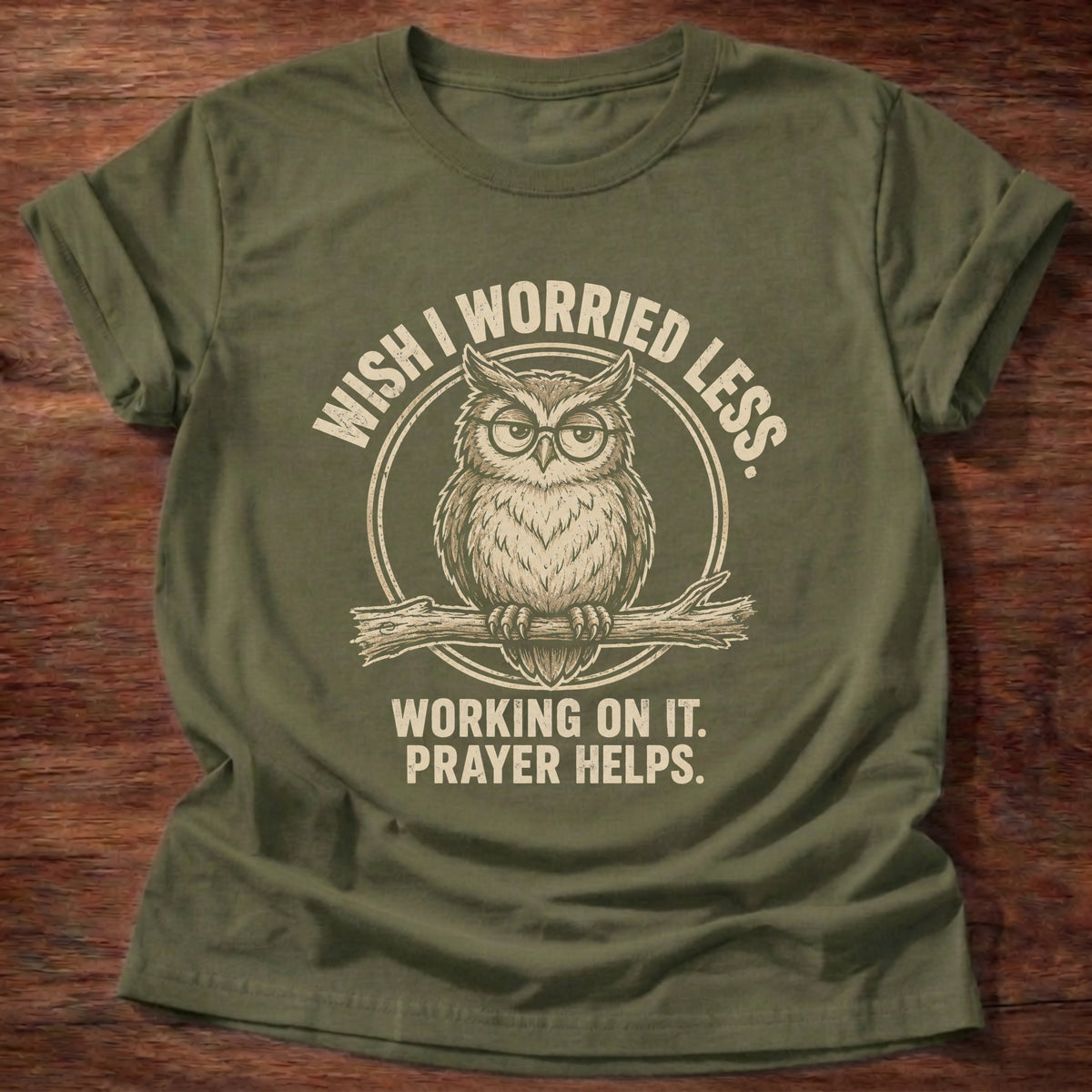 Military Green t-shirt printed with a worried owl graphic and 'Wish I worried less. Working on it. Prayer helps.' 1 Peter 5:7 faith based gift