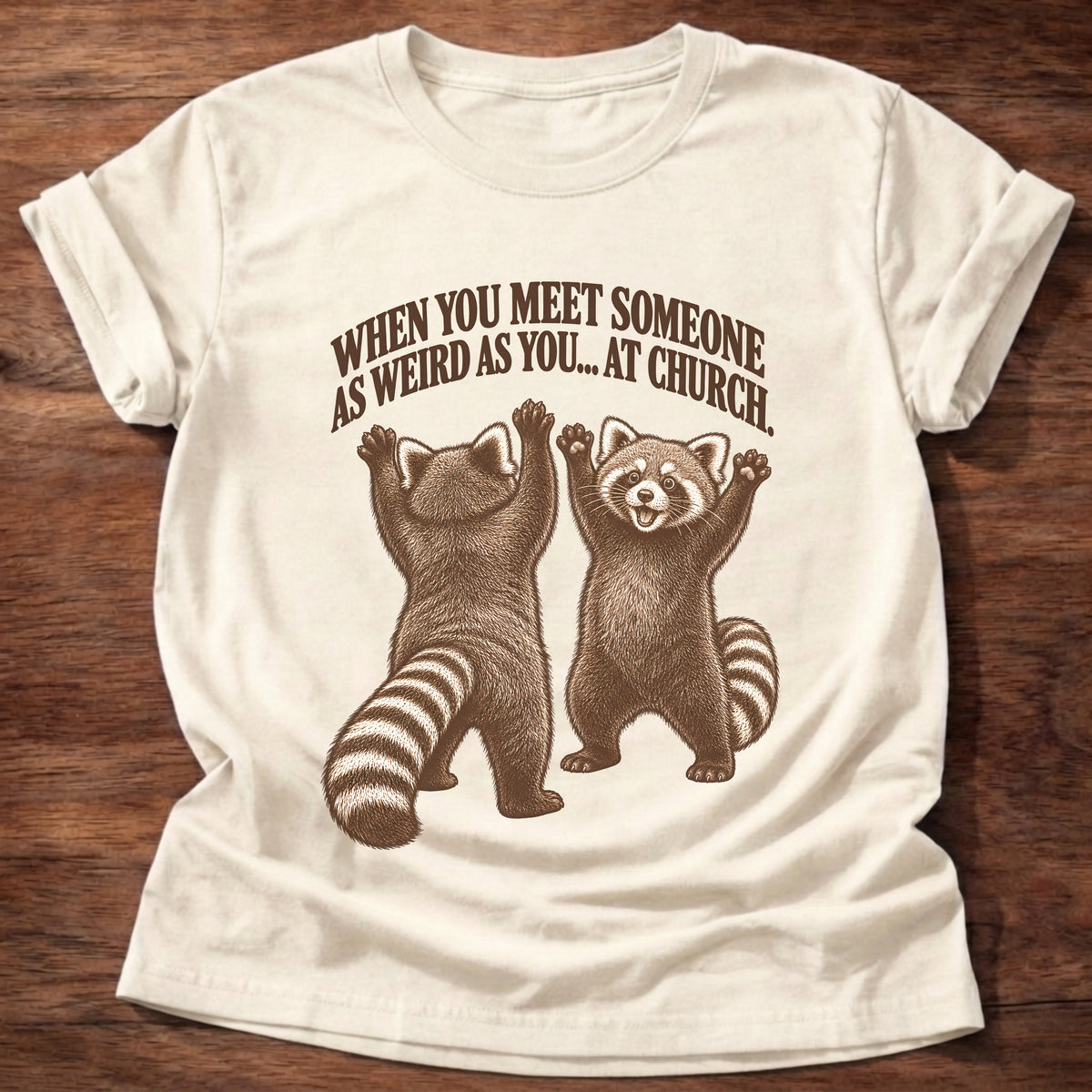 Natural t-shirt printed with two excited red pandas throwing their arms up graphic and “When you meet someone as weird as you... at church.” faith based gift