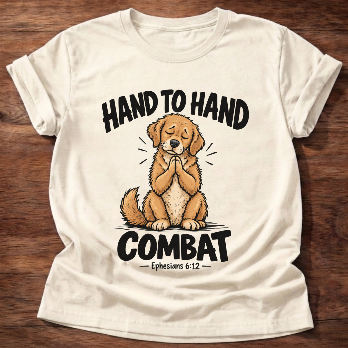 Natural t-shirt printed with a golden retriever puppy with eyes closed and paws folded in prayer graphic and “Hand to hand combat” Ephesians 6:12 faith based gift