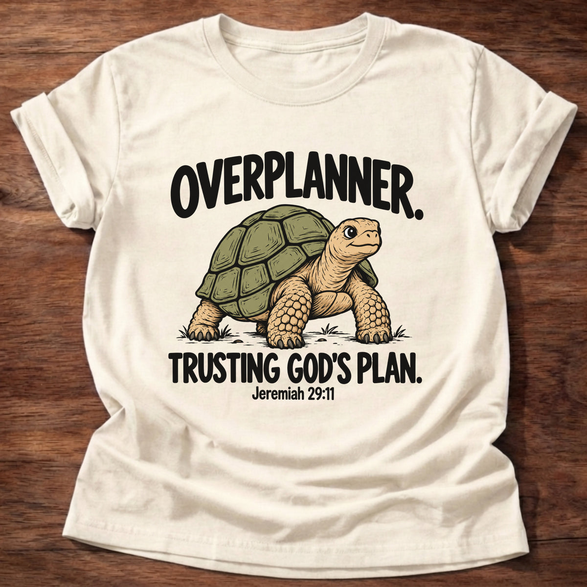 Natural t-shirt printed with a turtle graphic and 'Overplanner. Trusting God's plan.' Jeremiah 29:11 faith based gift