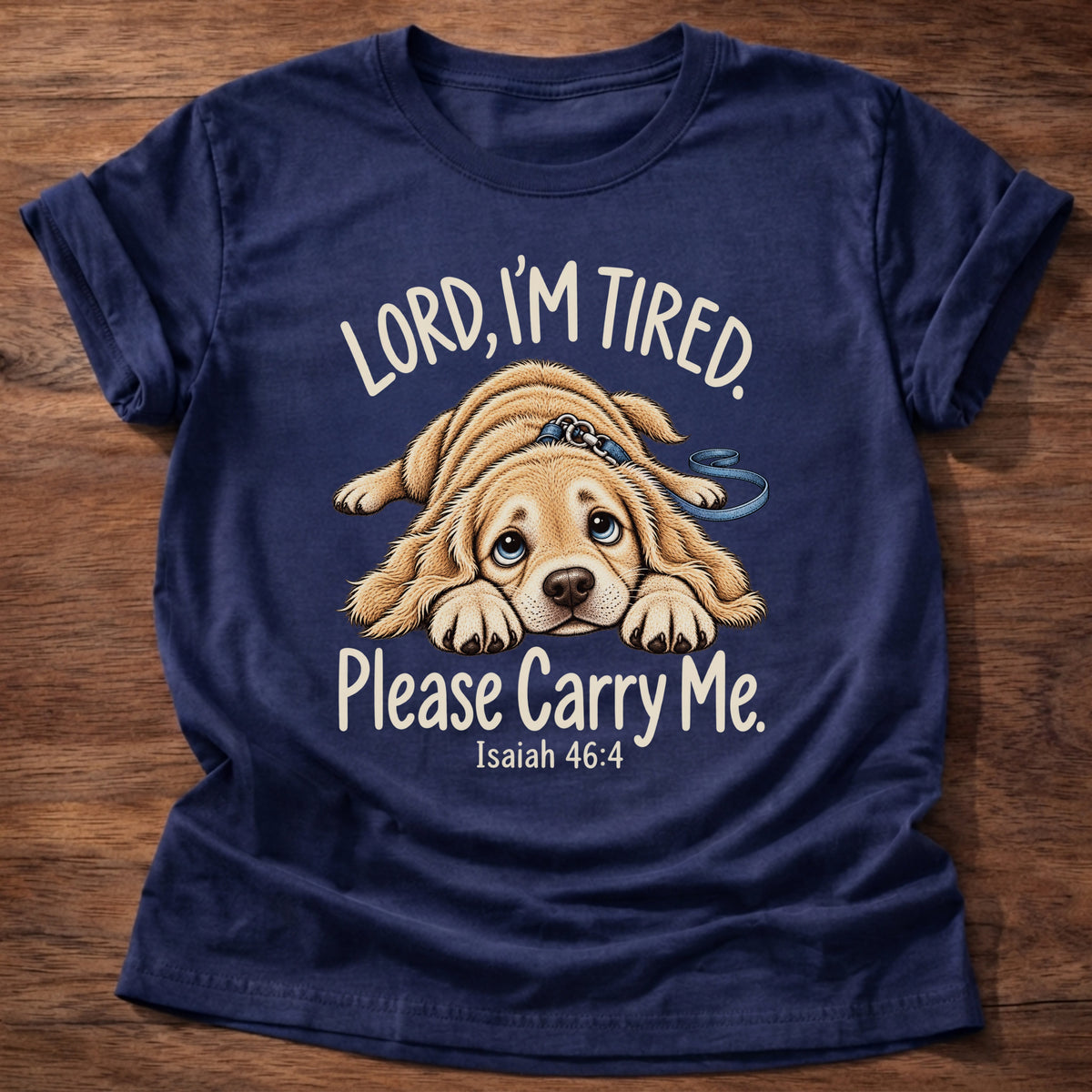 Navy t-shirt printed with a tired puppy lying flat on the floor graphic and “Lord, I'm tired. Please carry me.” Isaiah 46:4 Christian shirt