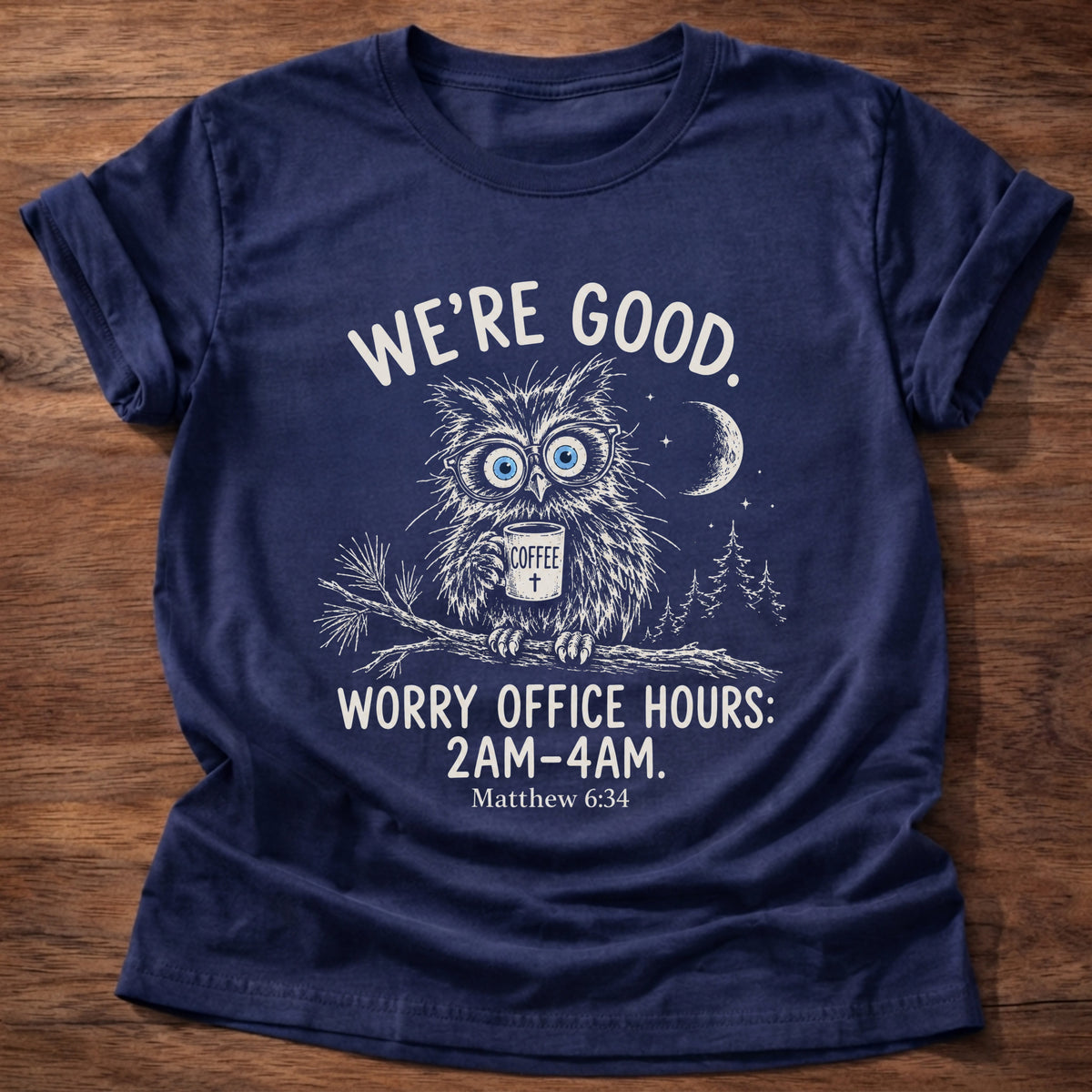 Navy t-shirt printed with a wide-eyed owl holding a mug on a moonlit branch graphic and “We're good. Worry office hours: 2AM-4AM.” Matthew 6:34 Christian shirt