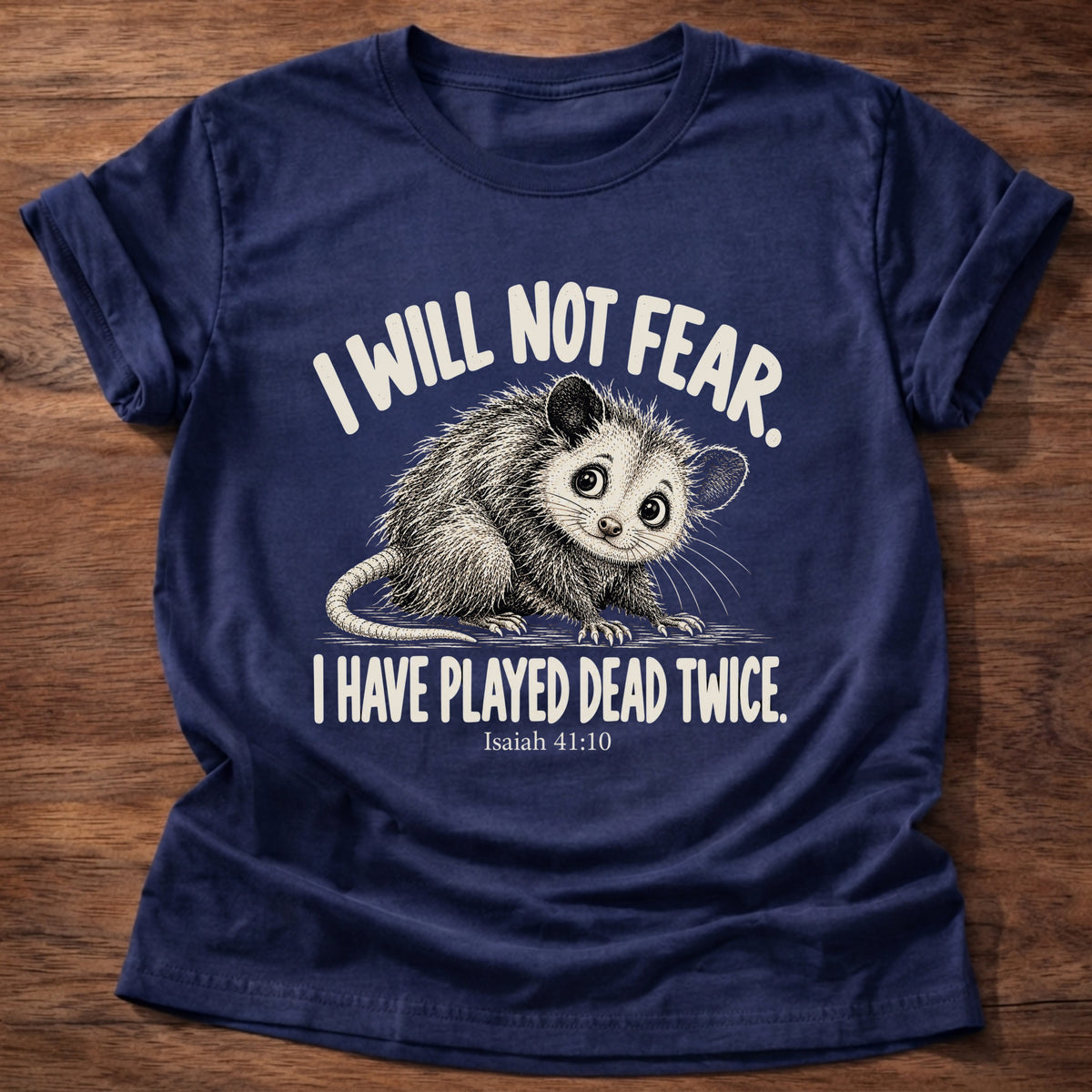 Navy t-shirt printed with a wide-eyed opossum graphic and “I will not fear. I have played dead twice.” Isaiah 41:10 Christian shirt
