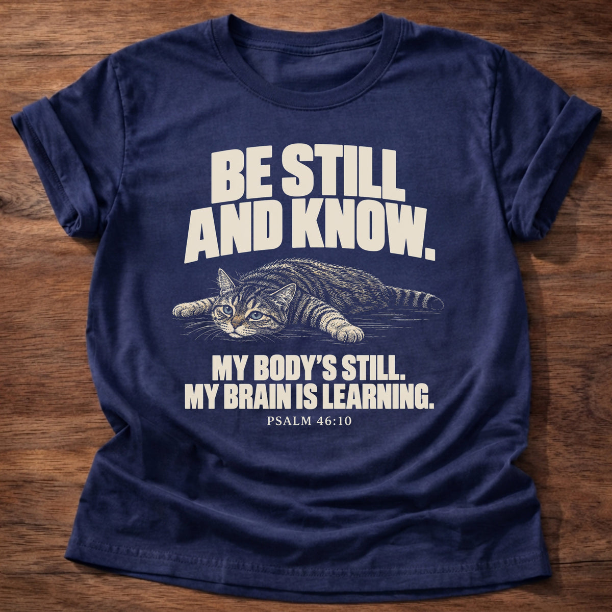 Brain Is Learning T-Shirt in Navy featuring a relaxed cat stretched out lying down and Psalm 46:10 overthinking humor design