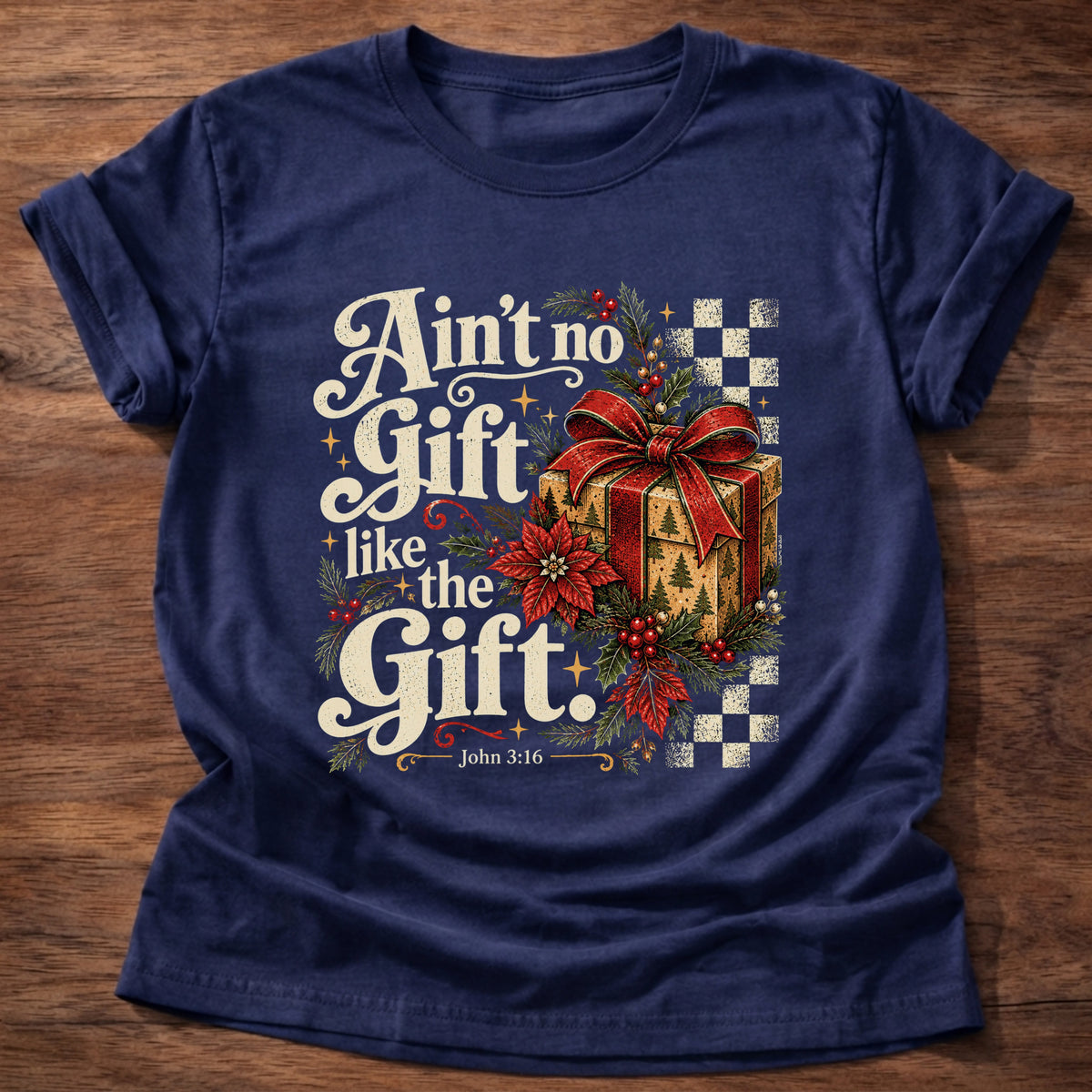 Navy t-shirt printed with a retro wrapped Christmas present with poinsettias and checkerboard graphic and “Ain't no Gift like the Gift.” John 3:16 Christian shirt