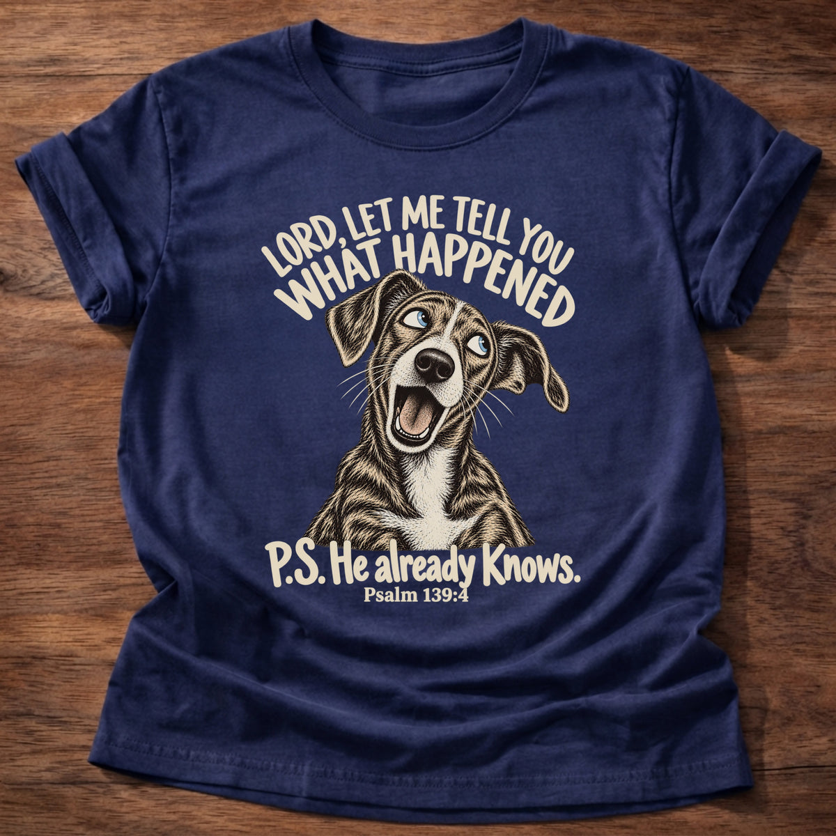 Navy t-shirt printed with a wide-eyed storytelling dog graphic and “Lord, let me tell you what happened. P.S. He already knows.” Psalm 139:4 Christian shirt