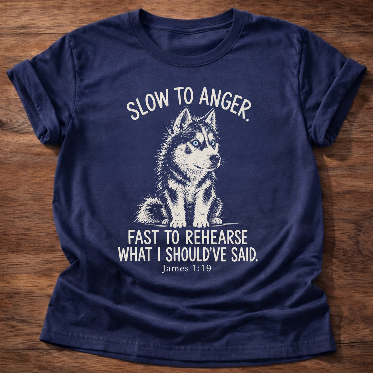 Slow To Anger T-Shirt in Navy featuring a blue-eyed husky puppy sitting calmly and James 1:19 patience humor design
