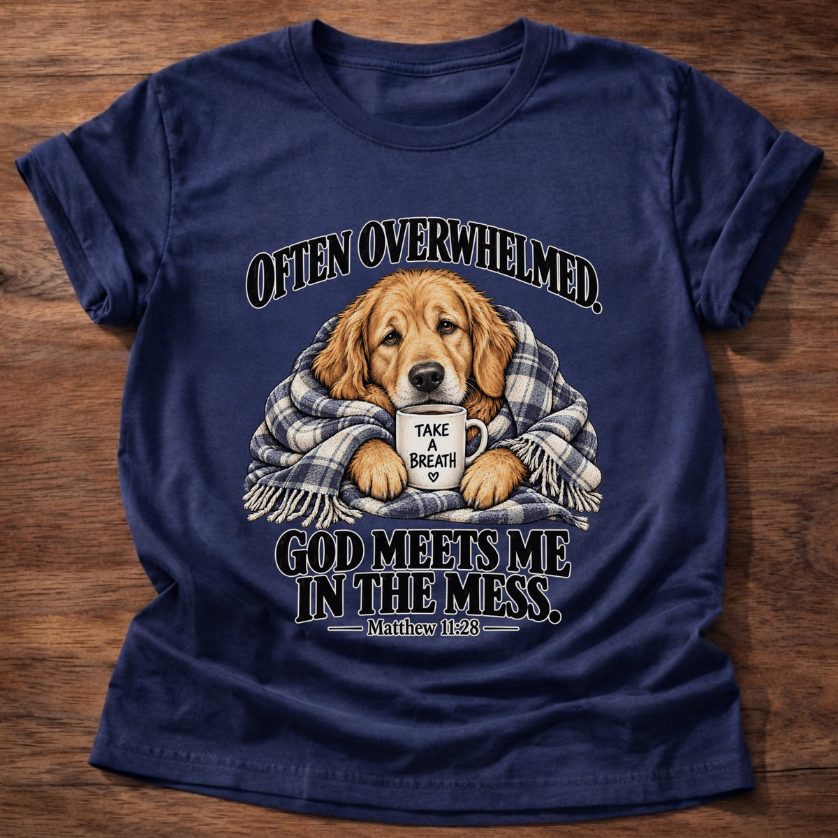 Navy t-shirt printed with a golden retriever wrapped in a plaid blanket holding a 'Take a Breath' mug graphic and “Often overwhelmed. God meets me in the mess.” Matthew 11:28 faith based gift