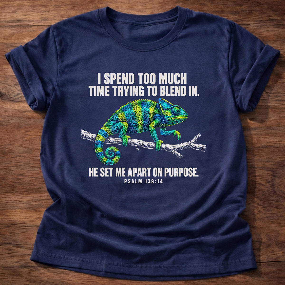 Navy t-shirt printed with a chameleon blending into a branch graphic and 'I spend too much time trying to blend in. He set me apart on purpose.' Psalm 139:14 faith based gift