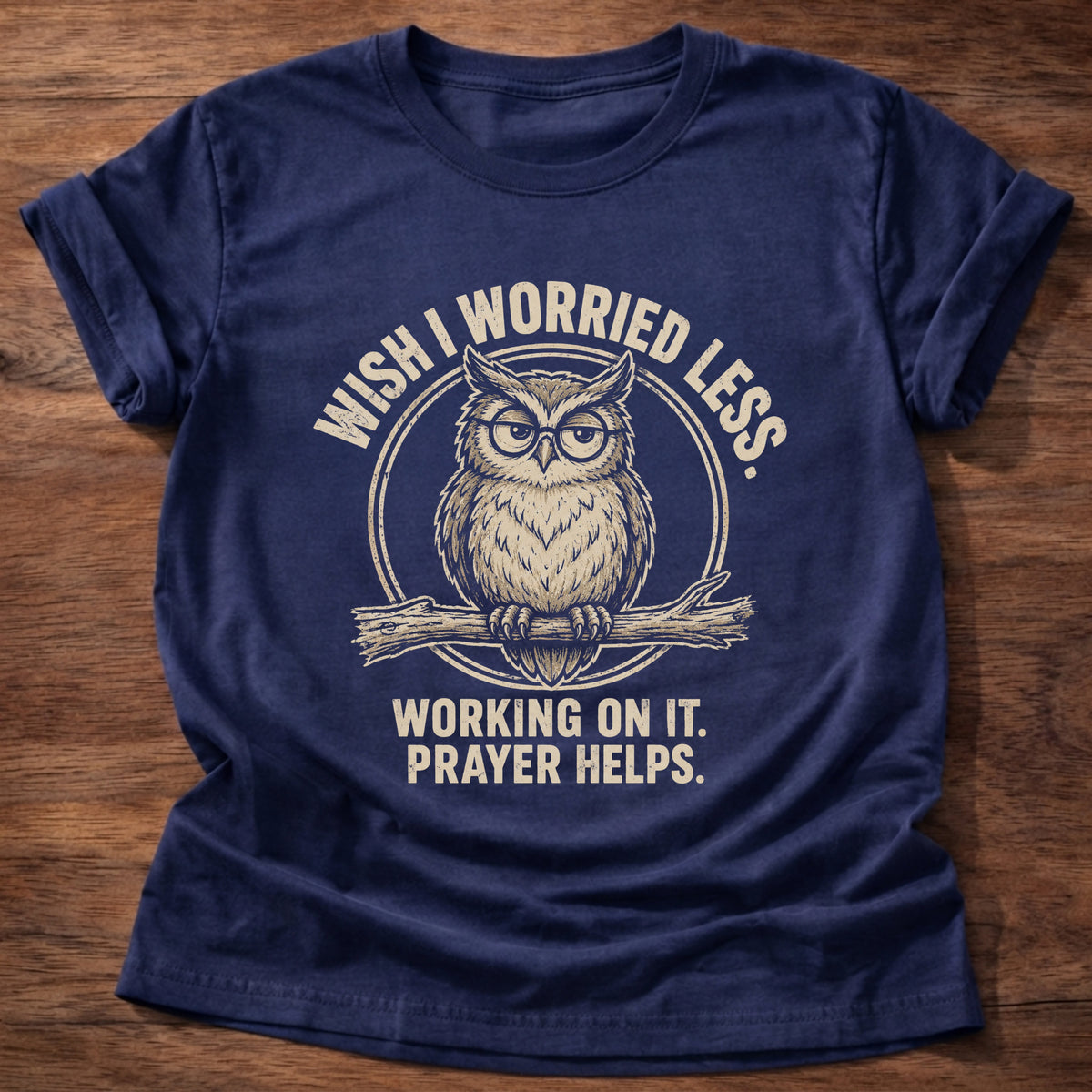 Navy t-shirt printed with a worried owl graphic and 'Wish I worried less. Working on it. Prayer helps.' 1 Peter 5:7 faith based gift