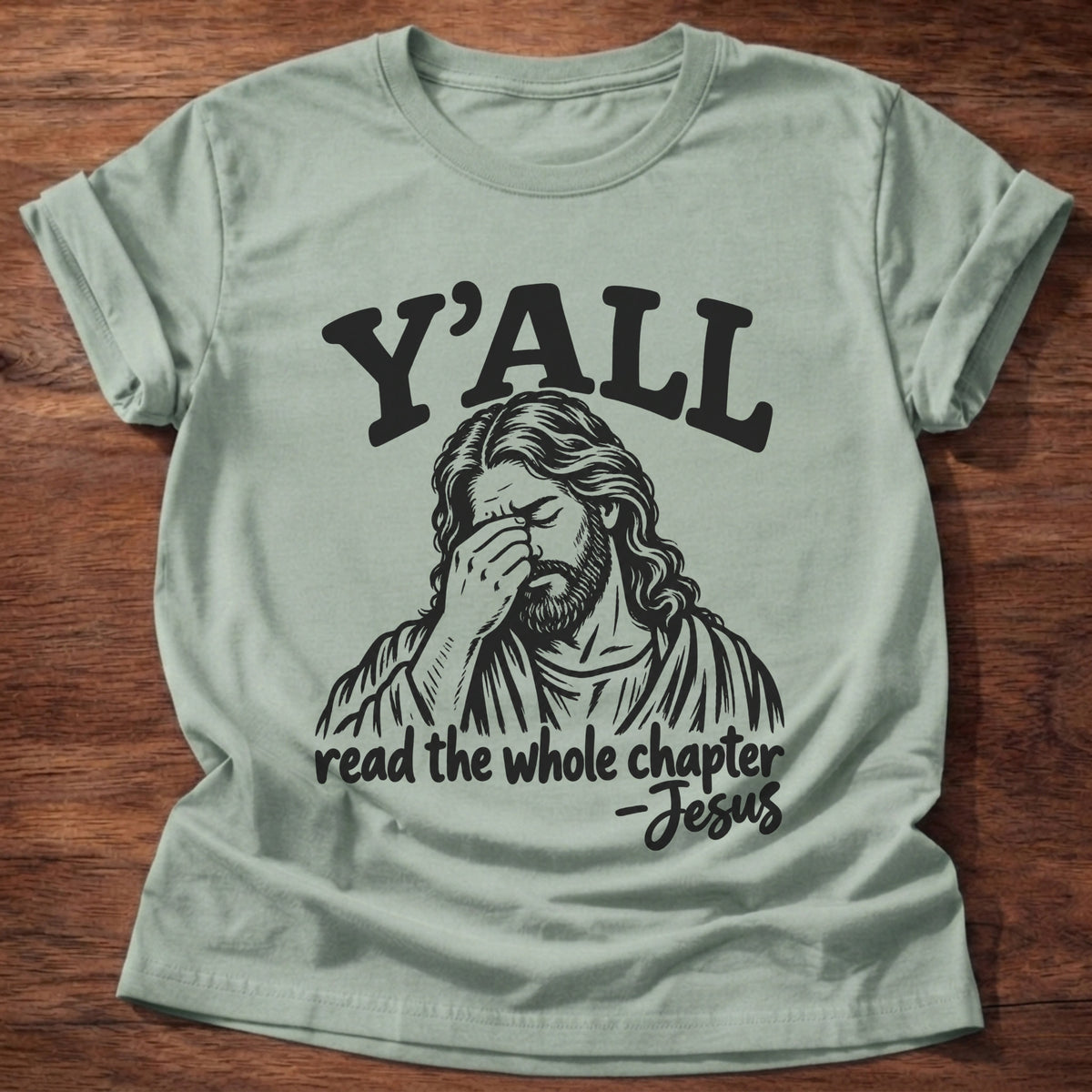 Sage t-shirt printed with a vintage-style illustration of Jesus with His hand to His forehead graphic and “Y'all read the whole chapter. -Jesus” Christian shirt
