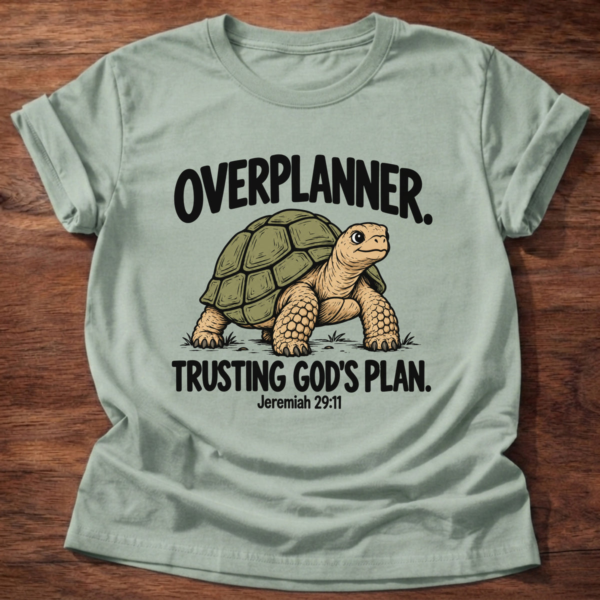 Sage t-shirt printed with a turtle graphic and 'Overplanner. Trusting God's plan.' Jeremiah 29:11 faith based gift