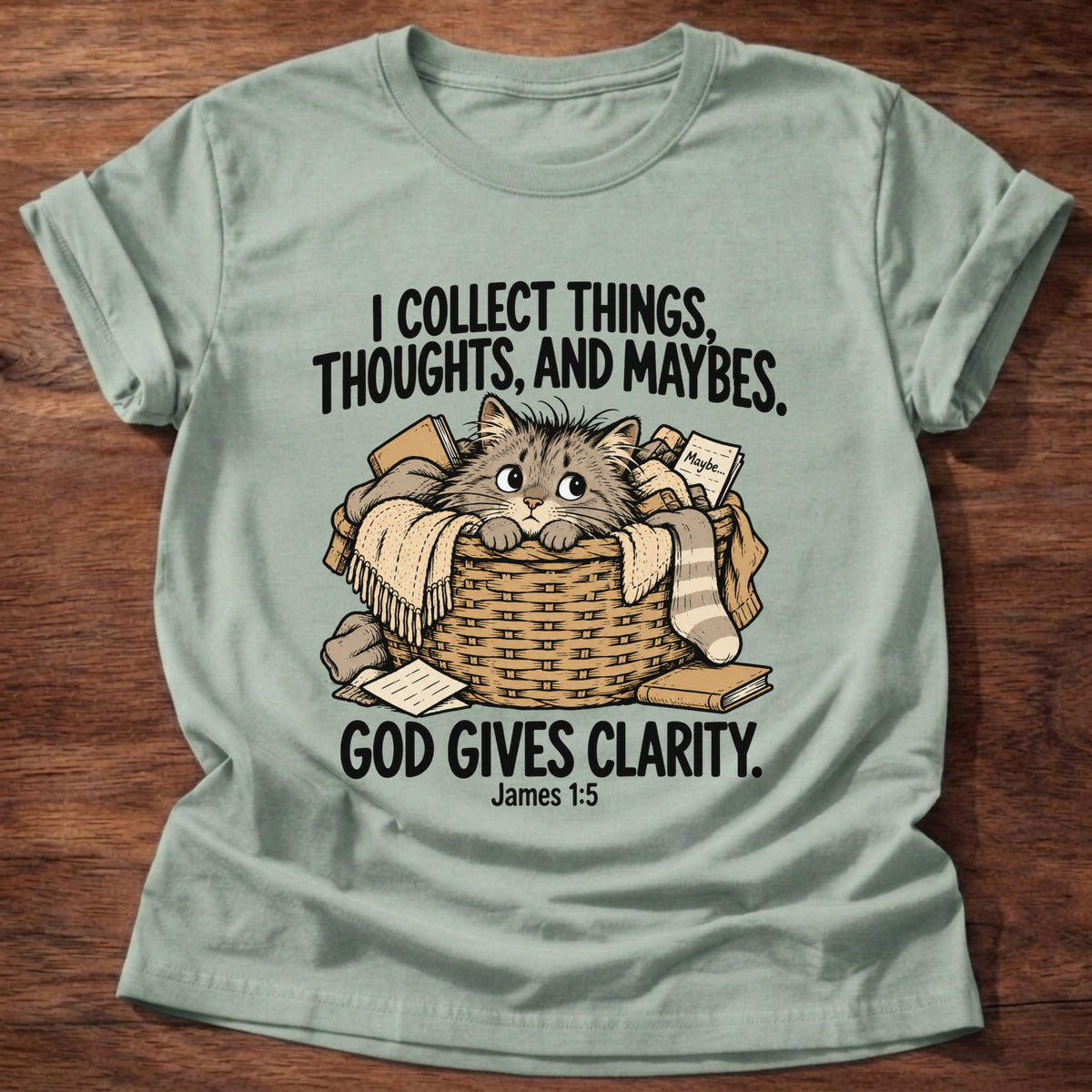 Sage t-shirt printed with a squirrel and a pile of collected items graphic and 'I collect worries instead of trust. But God provides.' Matthew 6:25-26 faith based gift