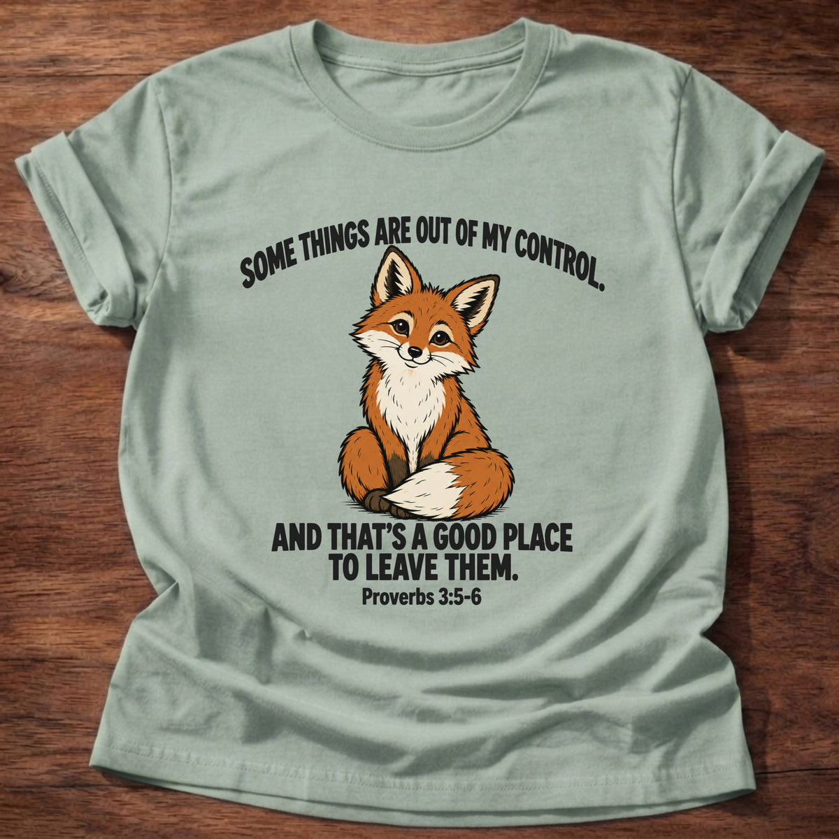 Sage t-shirt printed with a fox graphic and 'Some things are out of my control. And that's a good place to leave them.' Proverbs 3:5-6 faith based gift