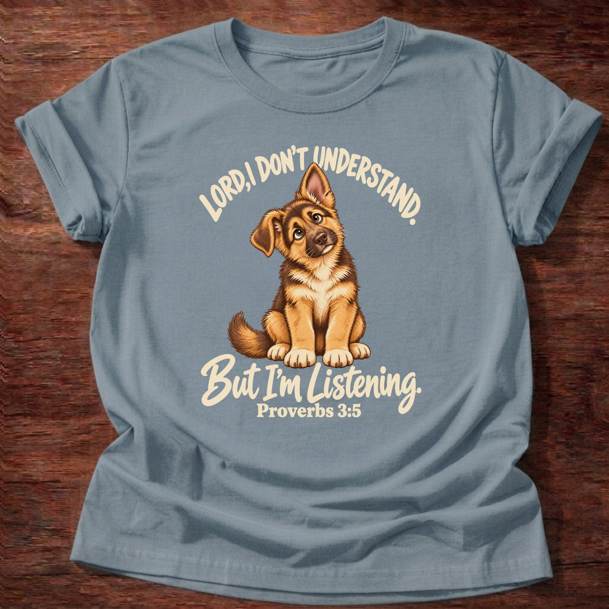 Stone Blue t-shirt printed with a German shepherd puppy tilting its head and “Lord, I don't understand. But I'm listening.” Proverbs 3:5 Christian shirt