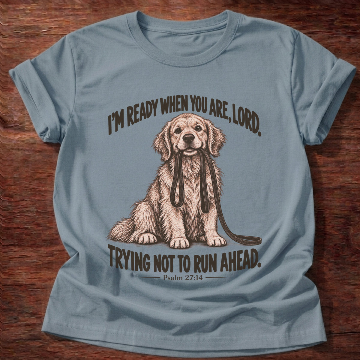 Stone Blue t-shirt printed with a golden retriever sitting with its leash in its mouth graphic and “I'm ready when you are, Lord. Trying not to run ahead.” Psalm 27:14 faith based gift
