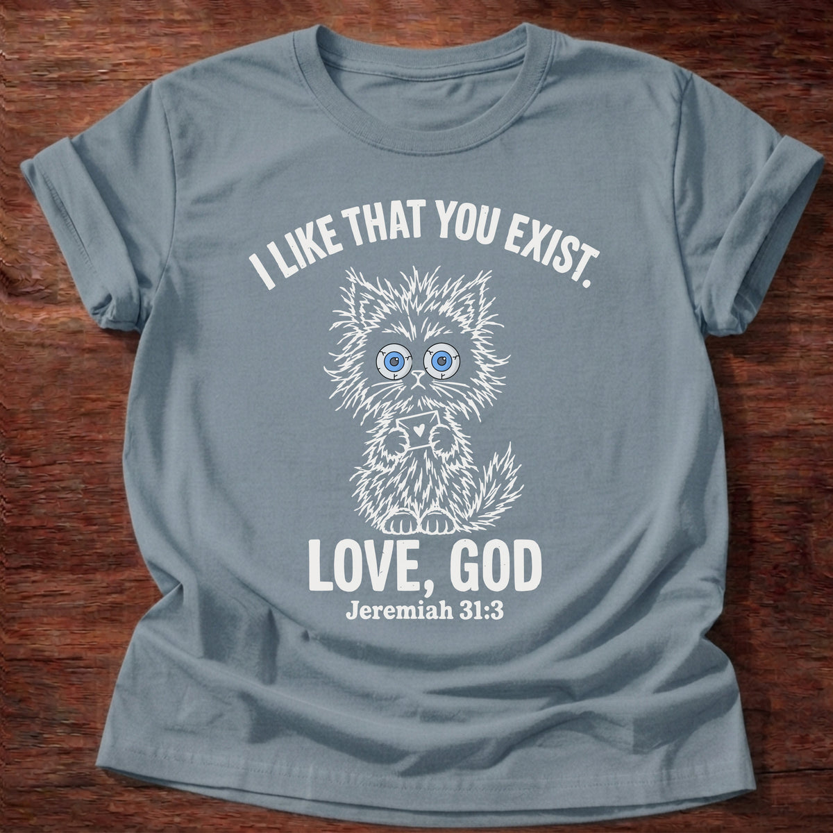Stone Blue t-shirt printed with a fluffy wide-eyed kitten graphic and “I like that you exist. Love, God.” Jeremiah 31:3 Christian shirt