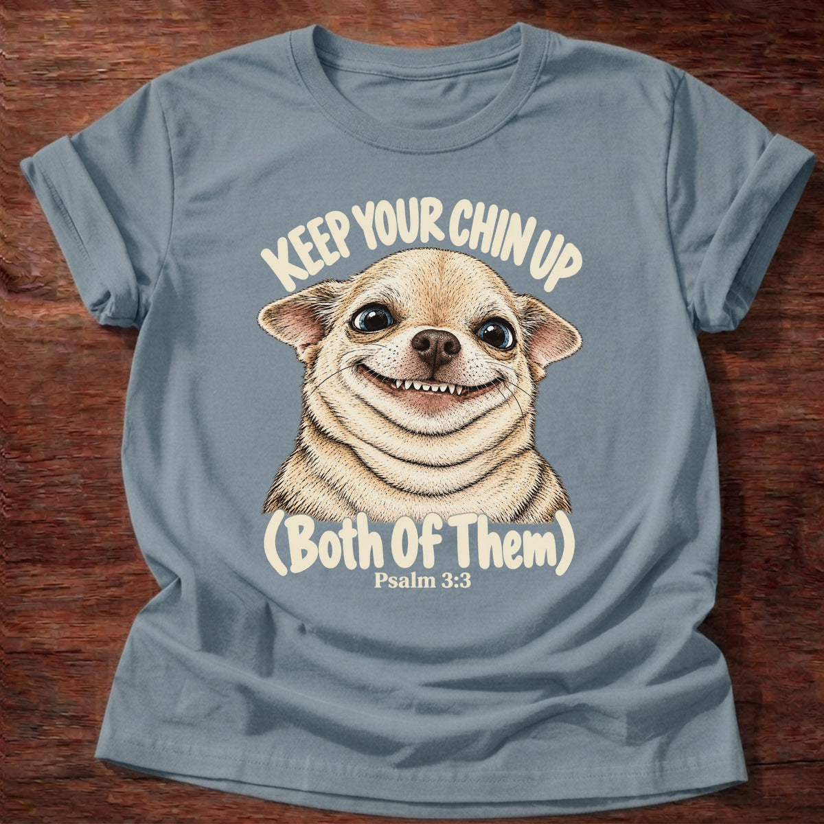 Stone Blue t-shirt printed with a grinning fluffy chihuahua graphic and “Keep your chin up. (Both of them.)” Psalm 3:3 Christian shirt